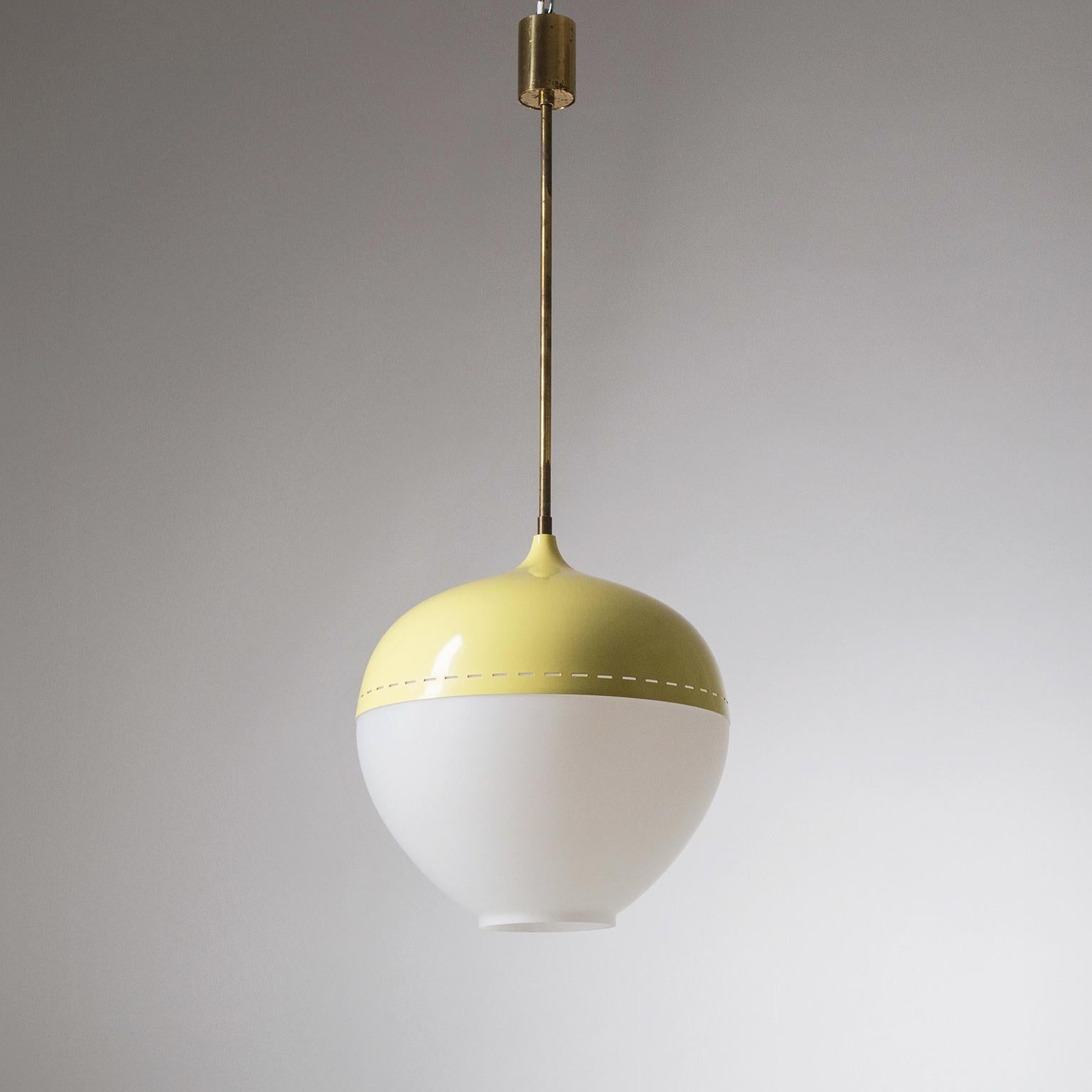 Rare Stilnovo pendant from the 1950s. Large onion-shaped satin glass diffuser with a yellow shade. Good original condition with patina on the brass and light loss of original paint. One original brass and ceramic E27 socket with new wiring. Original