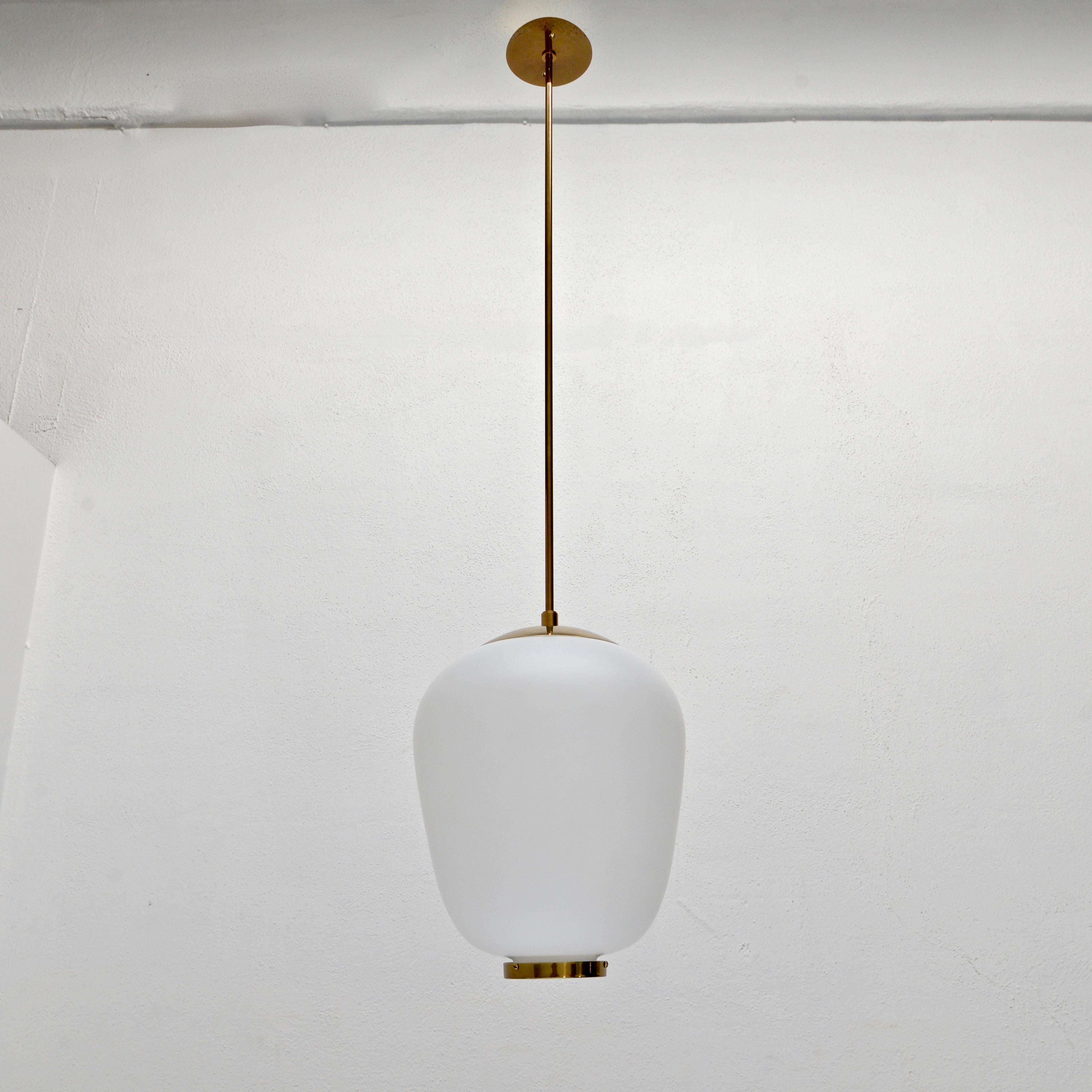 Classical beautiful naturally aged brass and glass 1950s Stilnovo pendant from Italy. With a single E26 medium based sockets and wired for use in the US. Light bulbs included with order.
Measurements:
OAD: 45” can be adjusted
Diameter