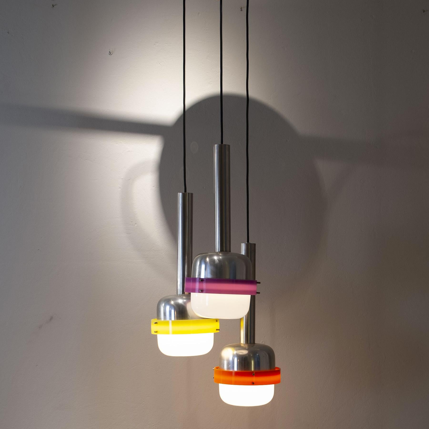 Suspension lamp composed of tree  elements in white and colored plex , production Stilnovo 60s.
