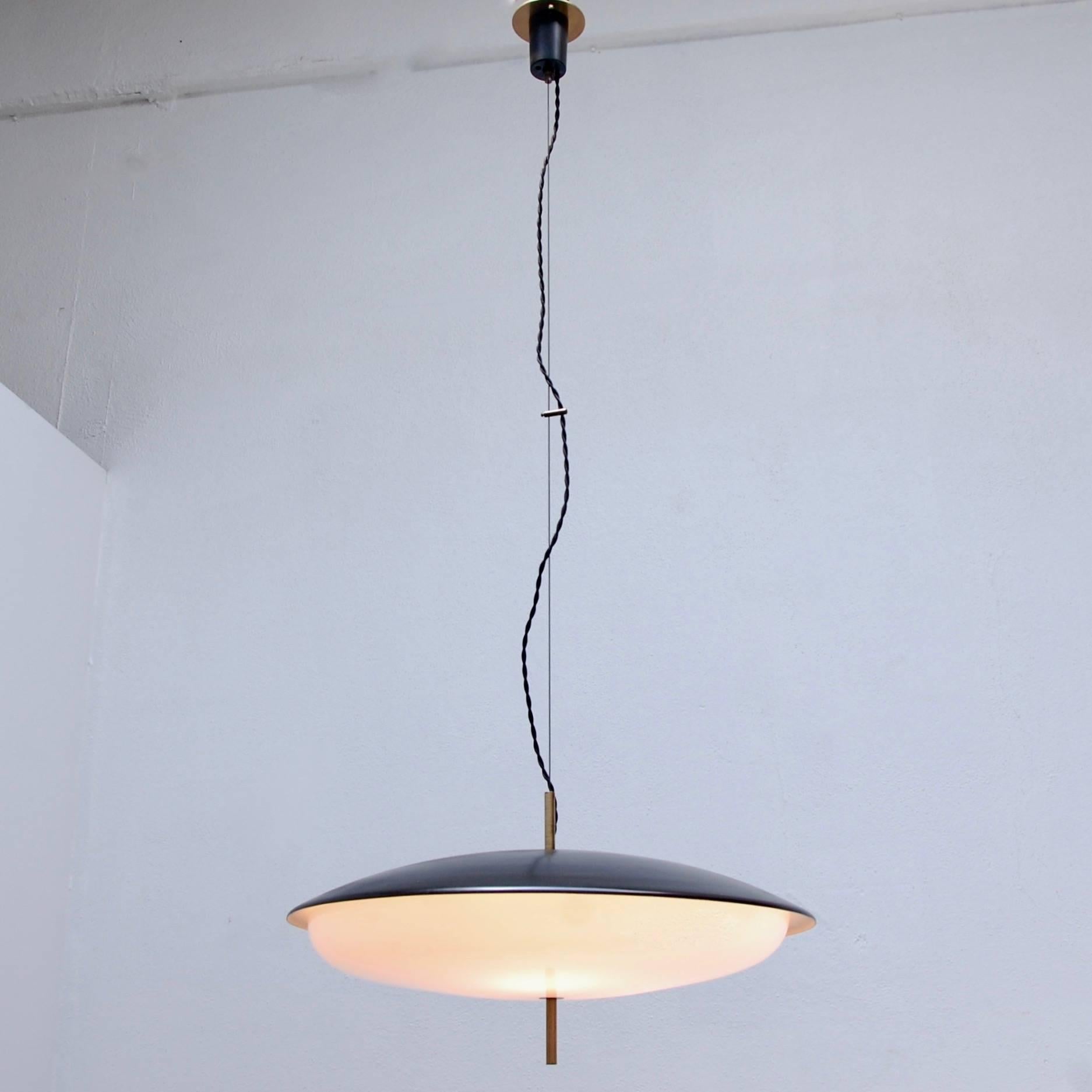 Classic and elegant midcentury Italian Stilnovo pendant in brass, painted aluminum and Lucite (diffuser). Currently wired for the US. Three medium-based E26 sockets. Overall drop adjustable upon request.
Measurements:
Fixture height 12”
Diameter