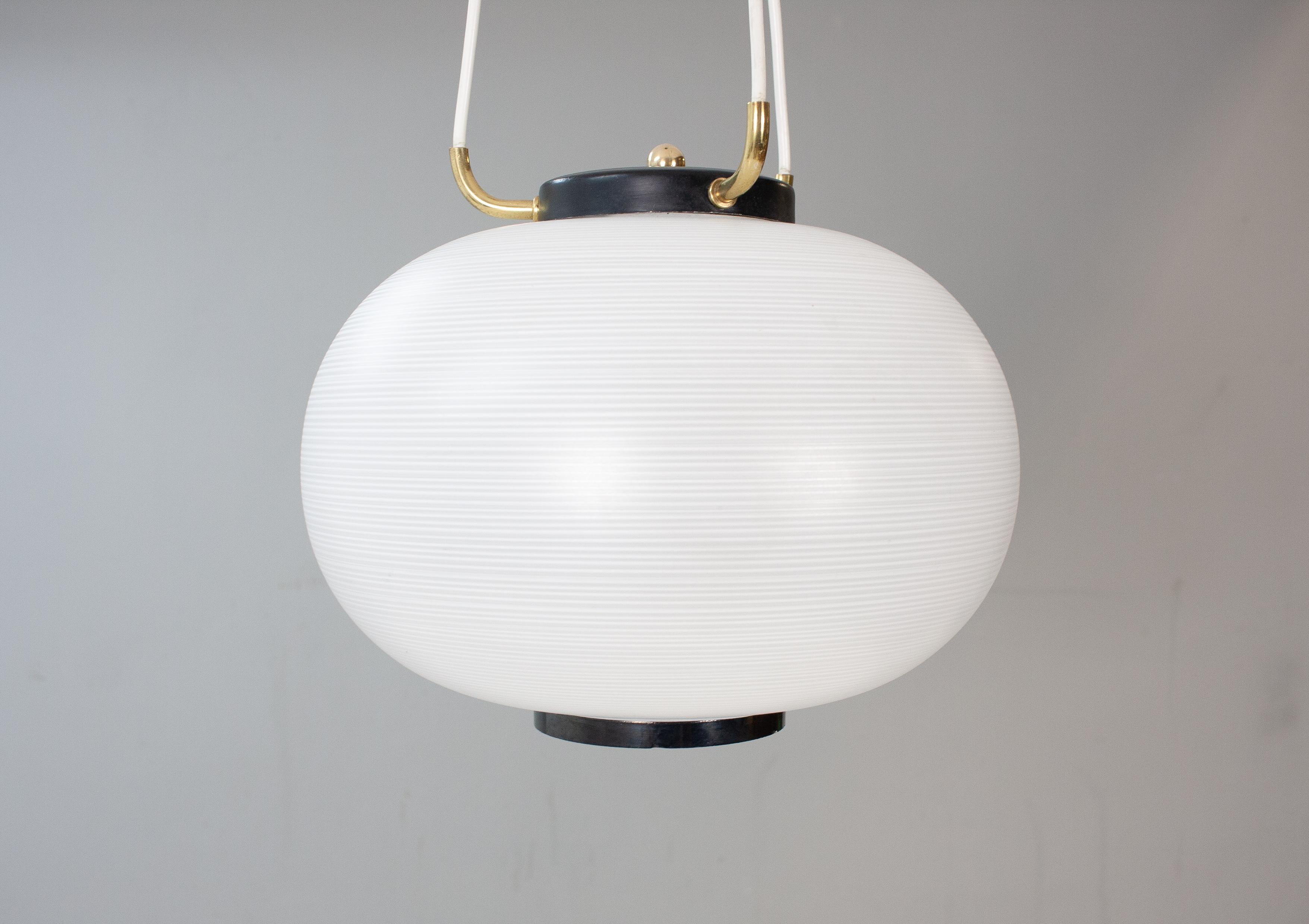 Stilnovo pendant lamp, 1950s-1960s. Featuring a striped opaline body and brass details.
new old stock, the brass canopy is new.