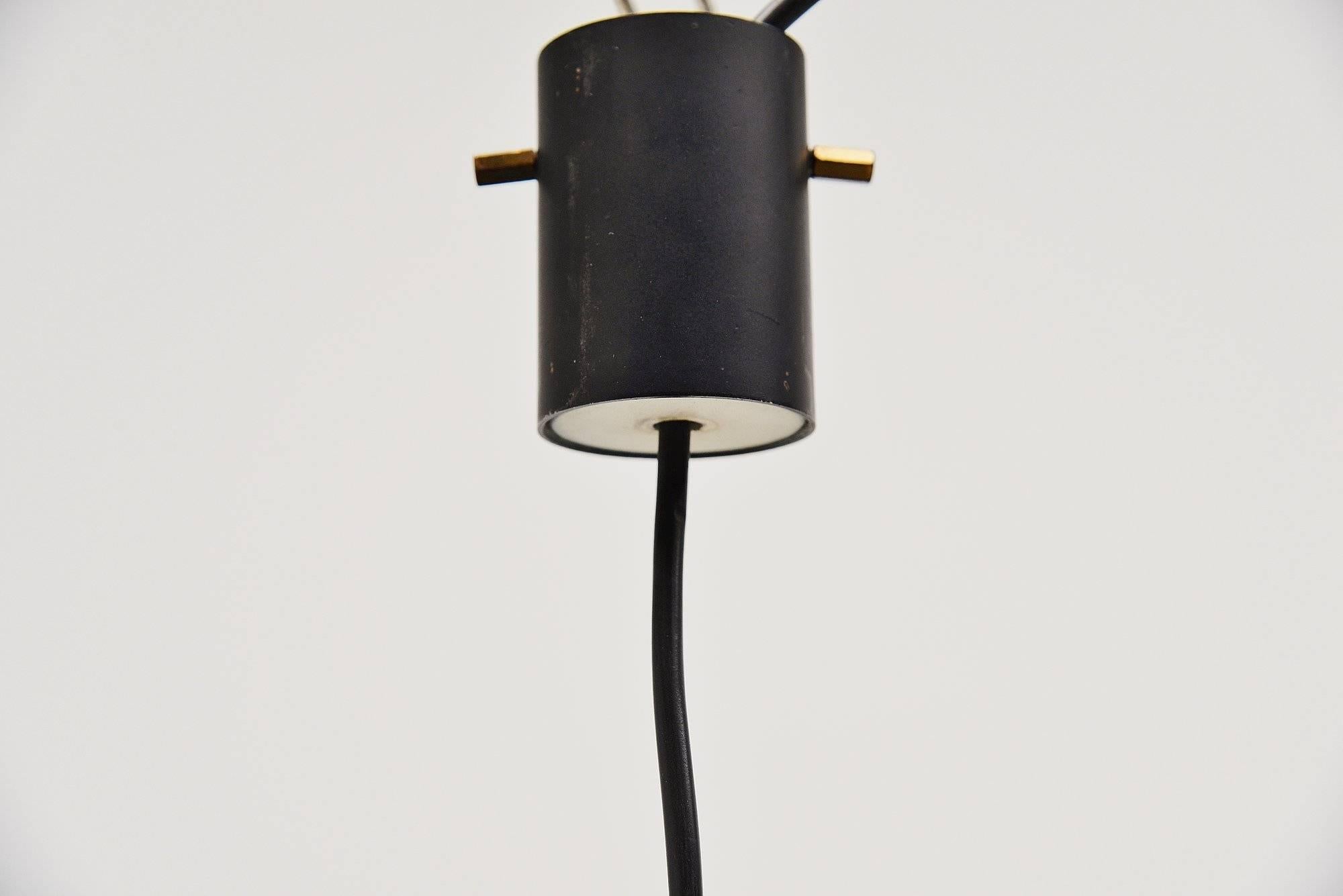 Nice pendant lamp model 1135 designed and made by Stilnovo, Italy 1960. This is for a very nice modernist shaped pendant lamp with a yellow lacquered metal shade holder, and a large white opaline glass diffuser shade. The lamp has a funny plexi