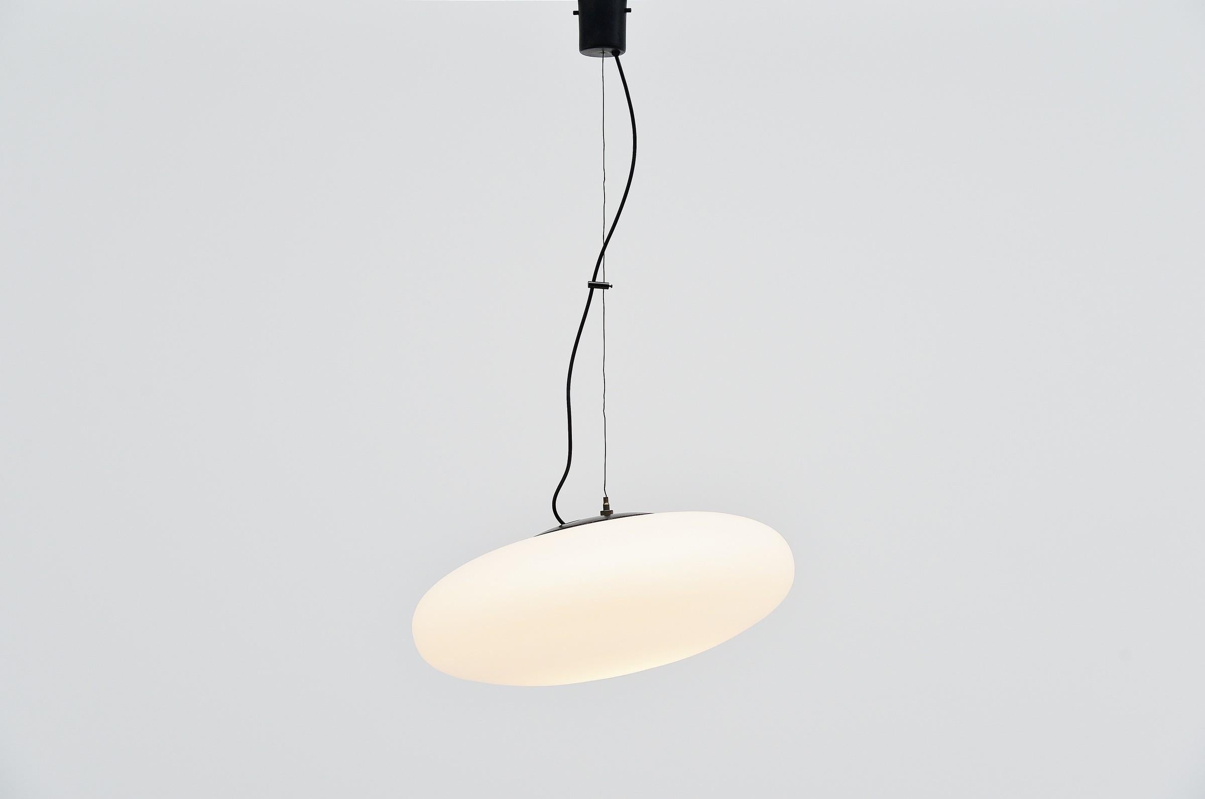 Very nice and large ufo shaped pendant model 1104 designed and manufactured by Stilnovo, Italy 1959. Oval shaped opaline glass diffuser closed with black painted socket plate. Black painted ceiling fitting. This position of the shade can be
