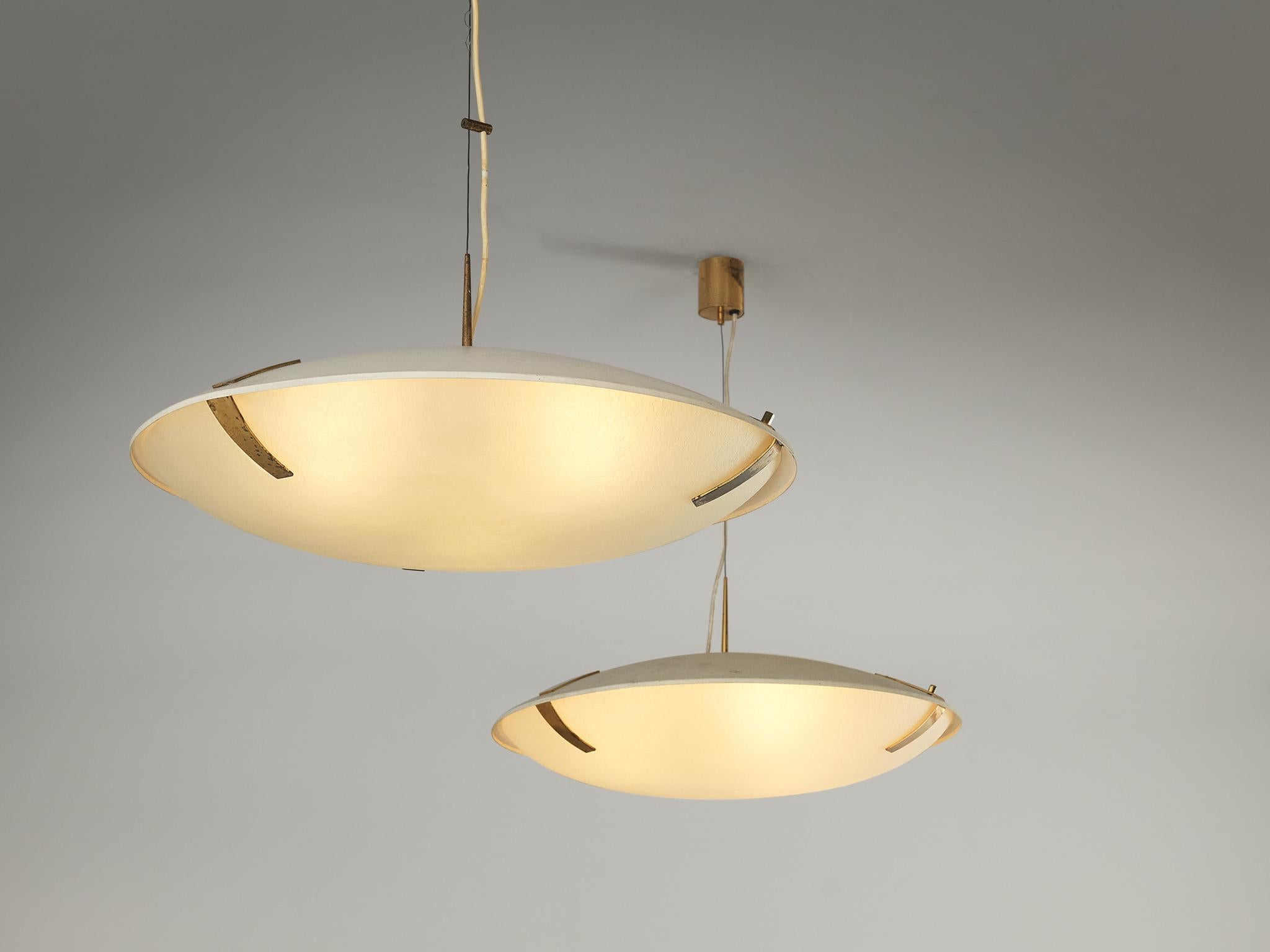Stilnovo, pendants '1140', aluminium, glass, brass, Italy, circa 1960

Gorgeous chandeliers or pendants model '1140', produced by Stilnovo in the 1960s. These magnificent pieces of design consist out of a flat, oval shade and top with beautiful
