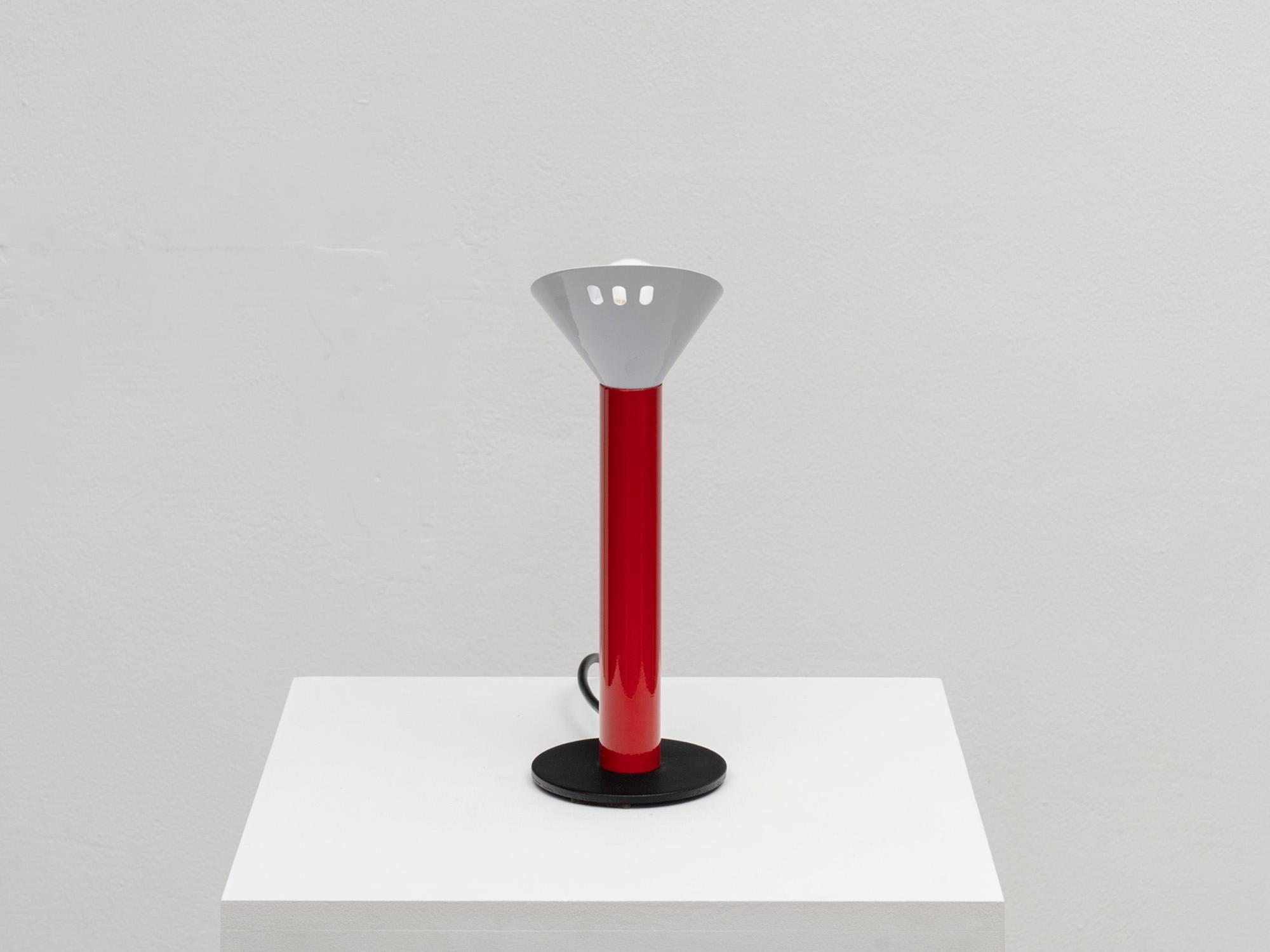 This Postmodern table lamp was manufactured in Italy by Stilnovo in the 1980s. The design is reminiscent of other pieces produced by Stilnovo and designed by Ettore Sottsass or Asahara Sigheaki, but the designer of this lamp is still unidentified.
