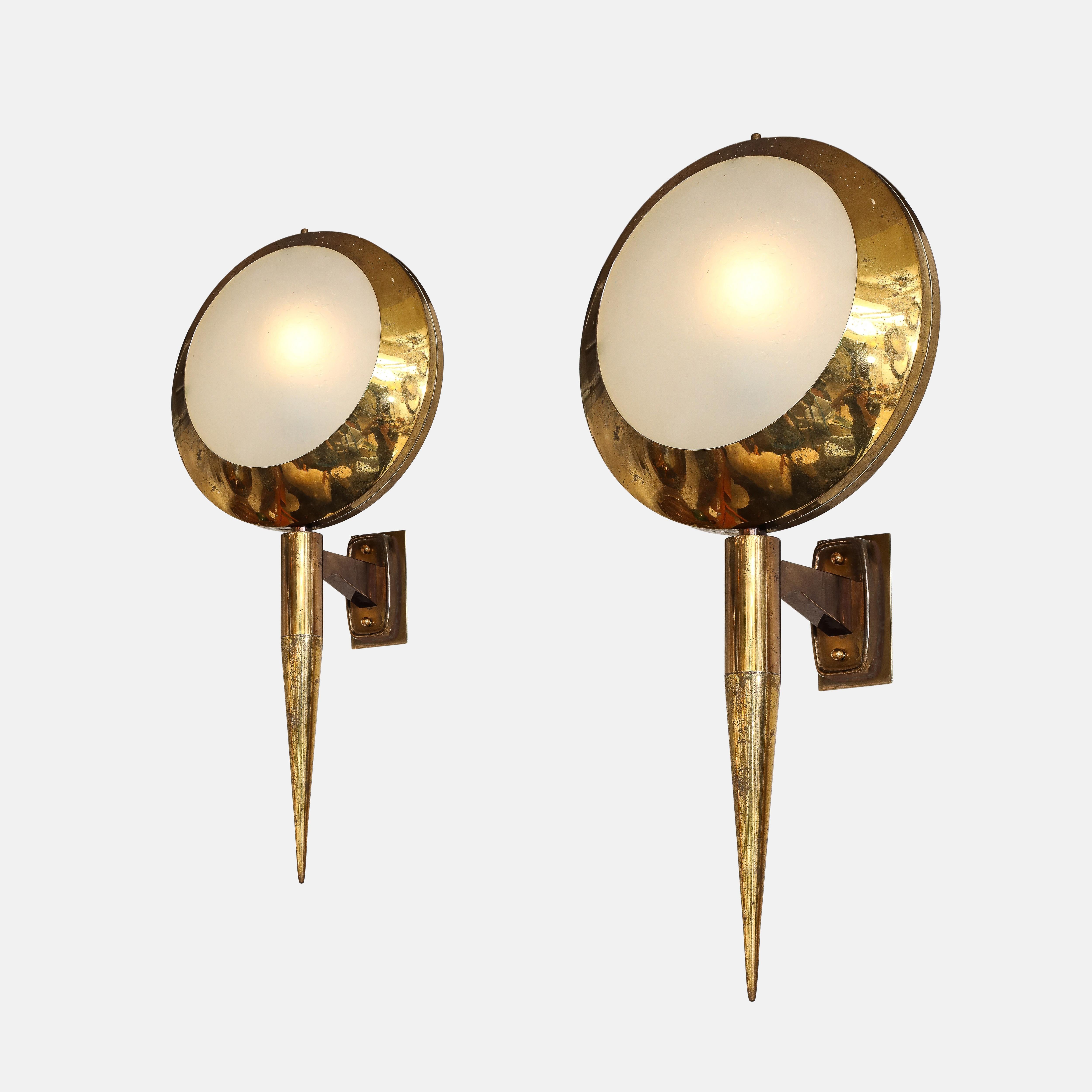 Stilnovo rare pair of large sconces or wall lights model 2128 each consisting of a polished and burnished brass structure which holds a textured glass diffuser, Italy, circa 1959.  These modernist chic sconces are large in scale and make a bold