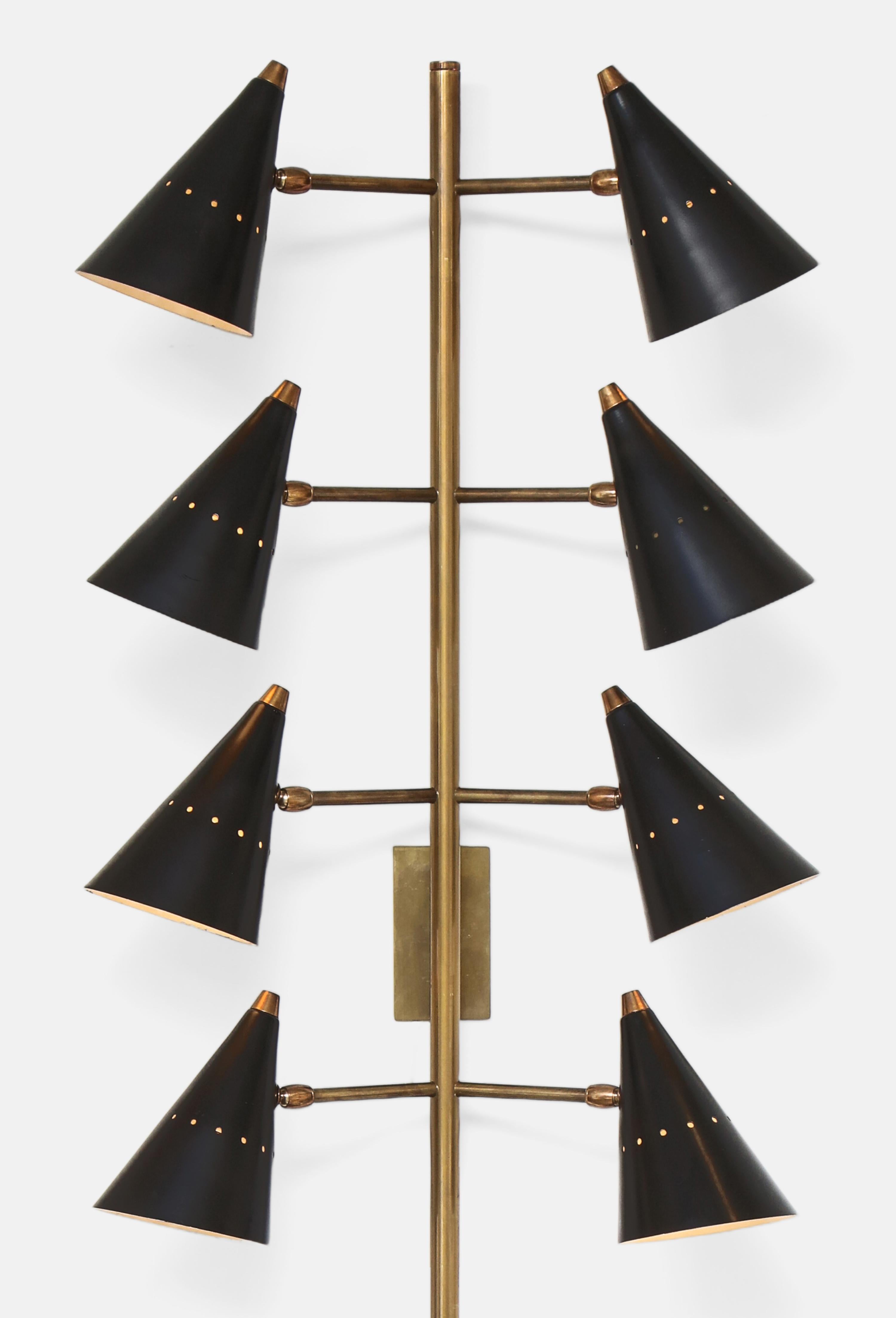 Stilnovo very rare and stunning tall pair of eight-arm wall lights with articulating conical shades in black lacquered aluminum suspended on brass arms and mounted long stem, Italy, 1950s. These original Stilnovo modernist wall lights are monumental