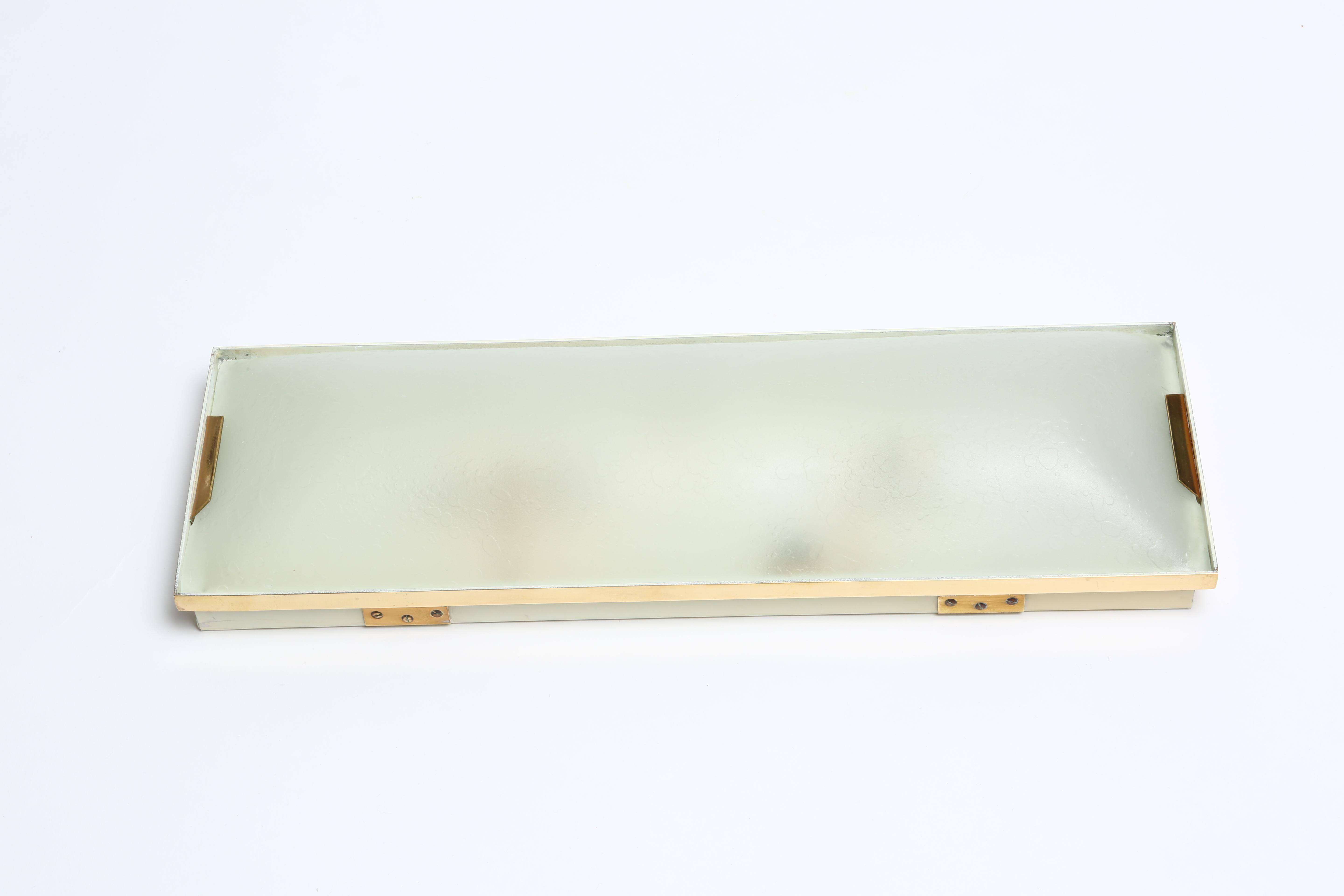Stilnovo rectangular flush mount.
Italy 1960s.
Textured glass, brass, metal.
