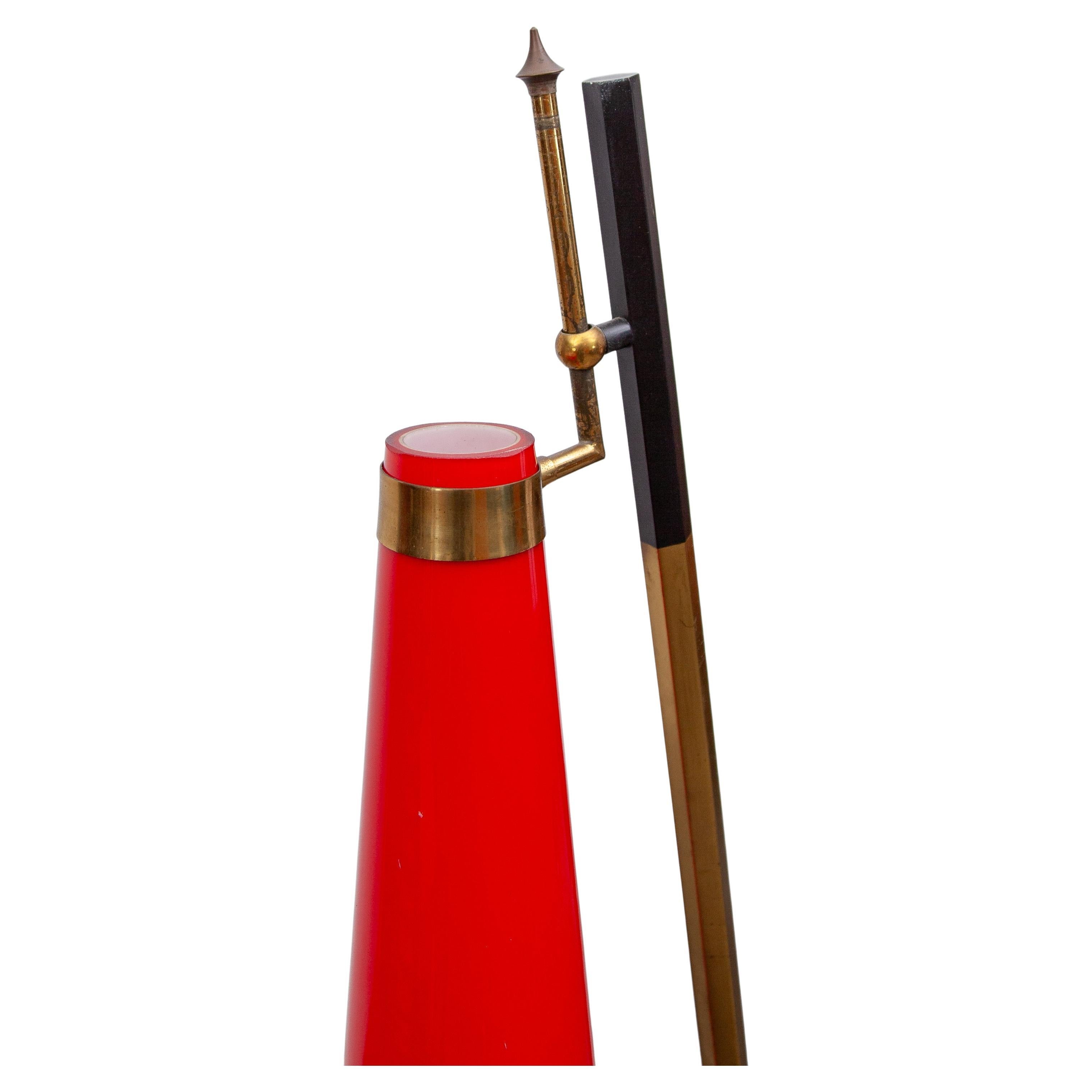 Mid-Century Modern Stilnovo sculptural floor lamp with an unique modern design executed in a warm red Murano mouth-blown glass shade by Vistosi, covered in white to intensify the light, the bottle shaped shade has a conical shape and is supported by