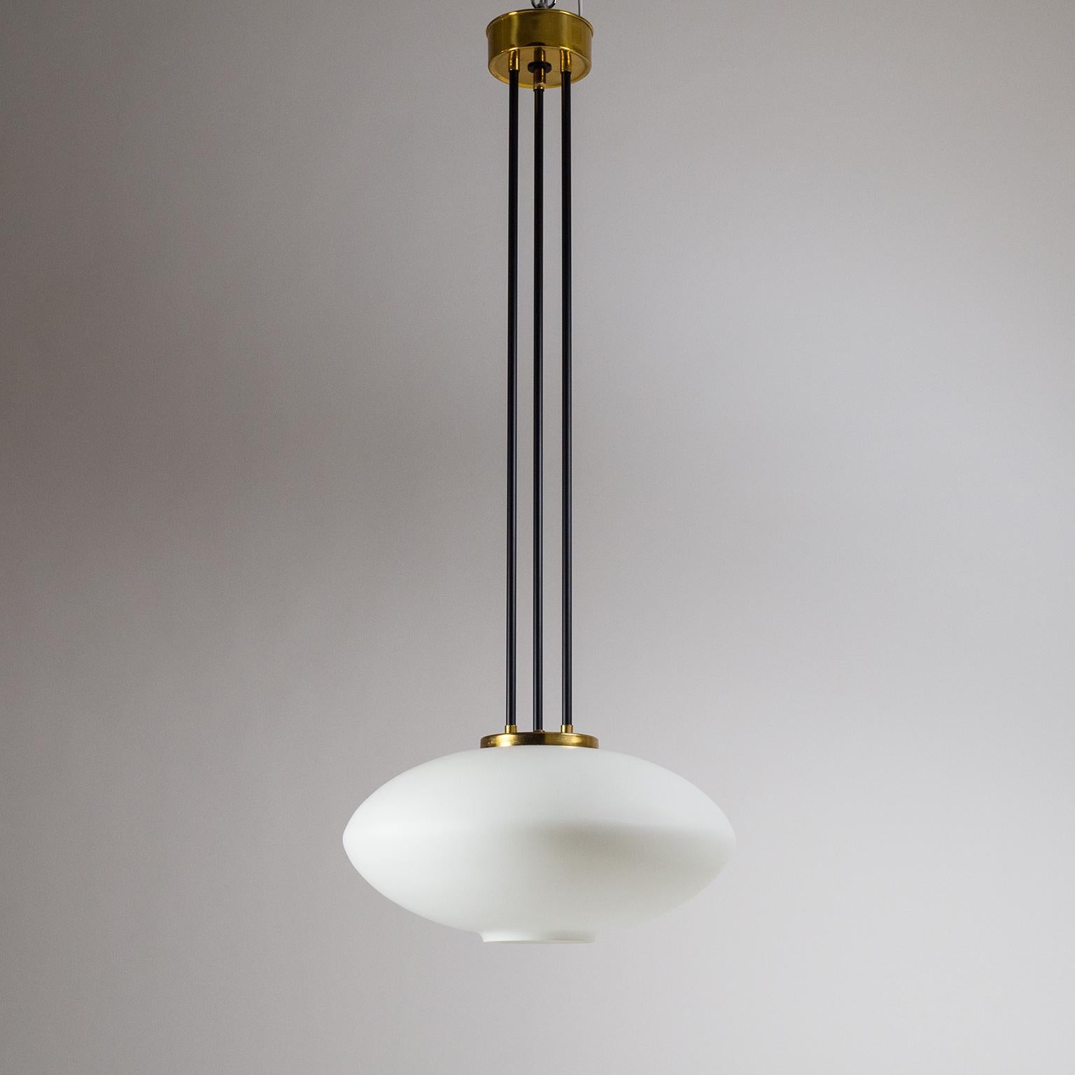 Remarkable modernist Stilnovo pendant/chandelier from the early 1960s. In typical Stilnovo manner the large glass body is made of satinated 