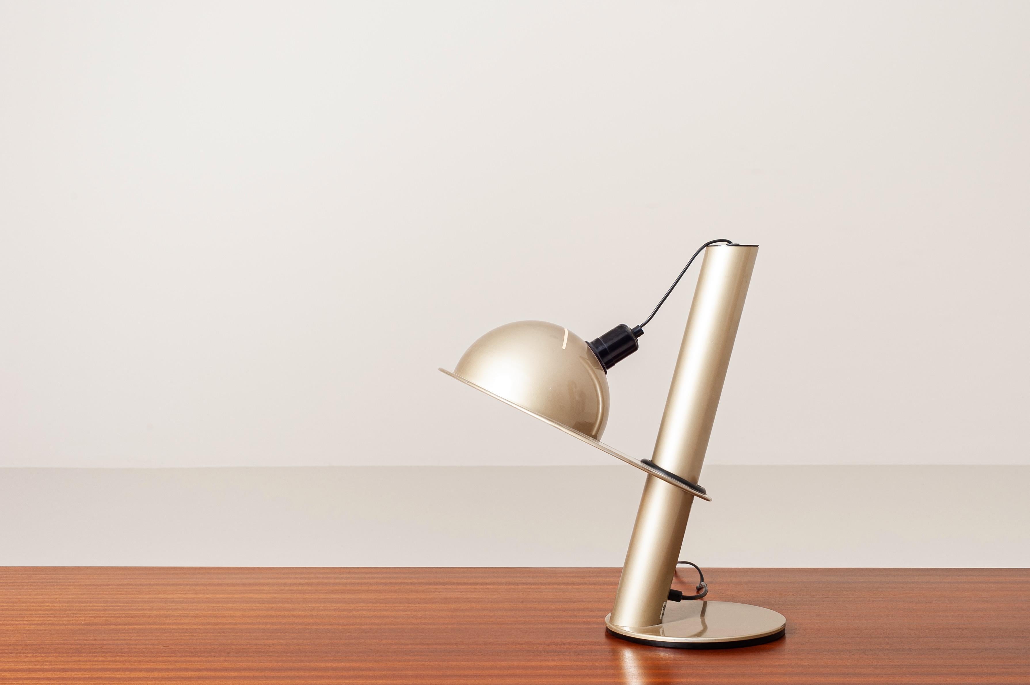 Unusual and alluring 'space age' table lamp manufactured by Stilnovo in the 1970s. Thanks to a rubber ring between the support base and the lampshade, this lamp can be adjusted in every direction and height.

Labelled ''Stilnovo Milano - Italy''