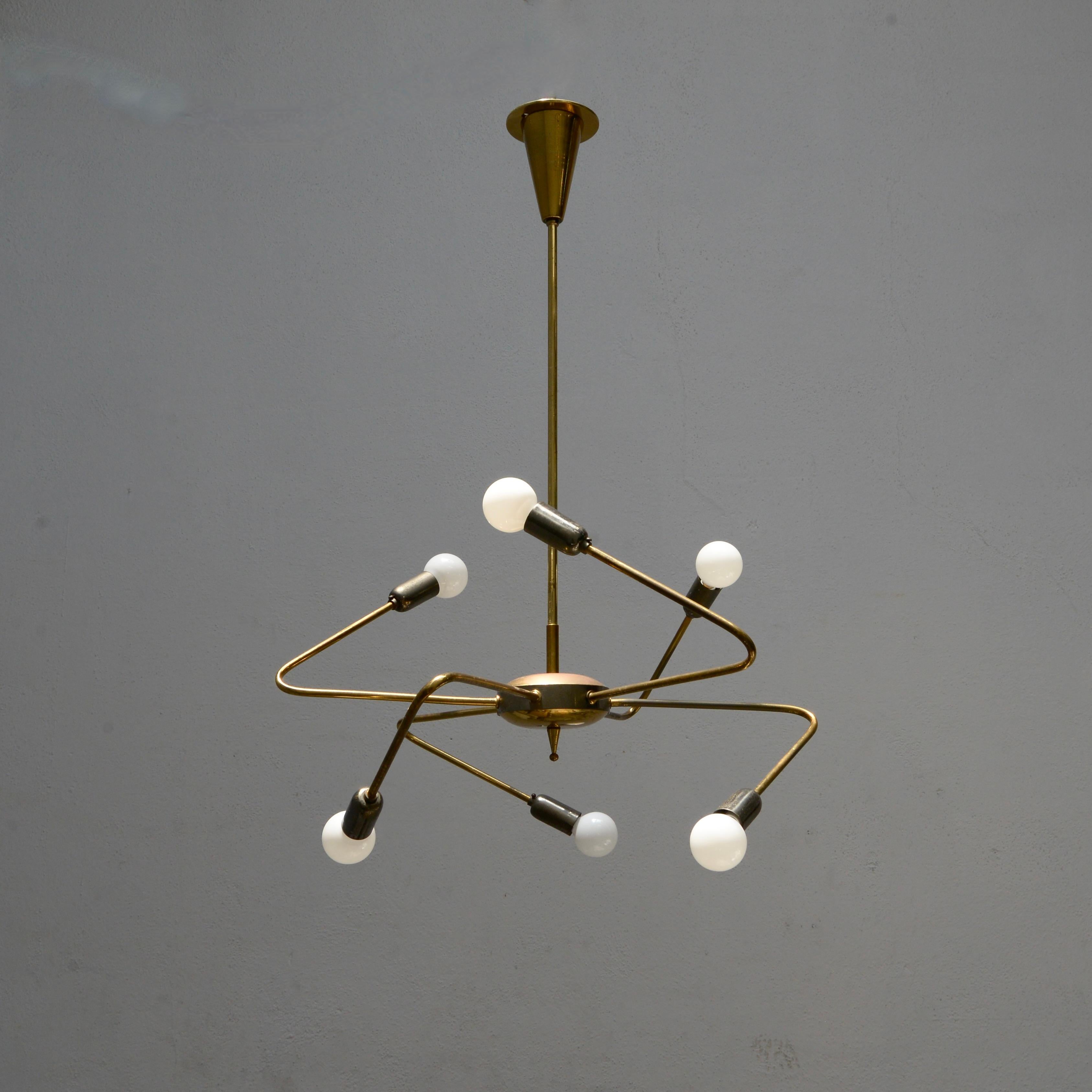 Wonderful  1950s brass Stilnovo Sputnik hanging fixture from Italy. Partially restored and rewired with 6 E12 candelabra based sockets, for use in the US. Original brass varied finishes. Light bulbs and all mounting hardware included with order.