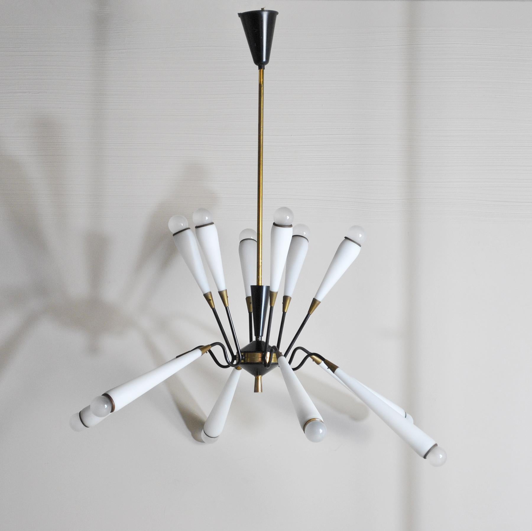Suspension chandelier with 12 lights, opal cones, details in brass, in the style of Stilnovo, late 1950s.