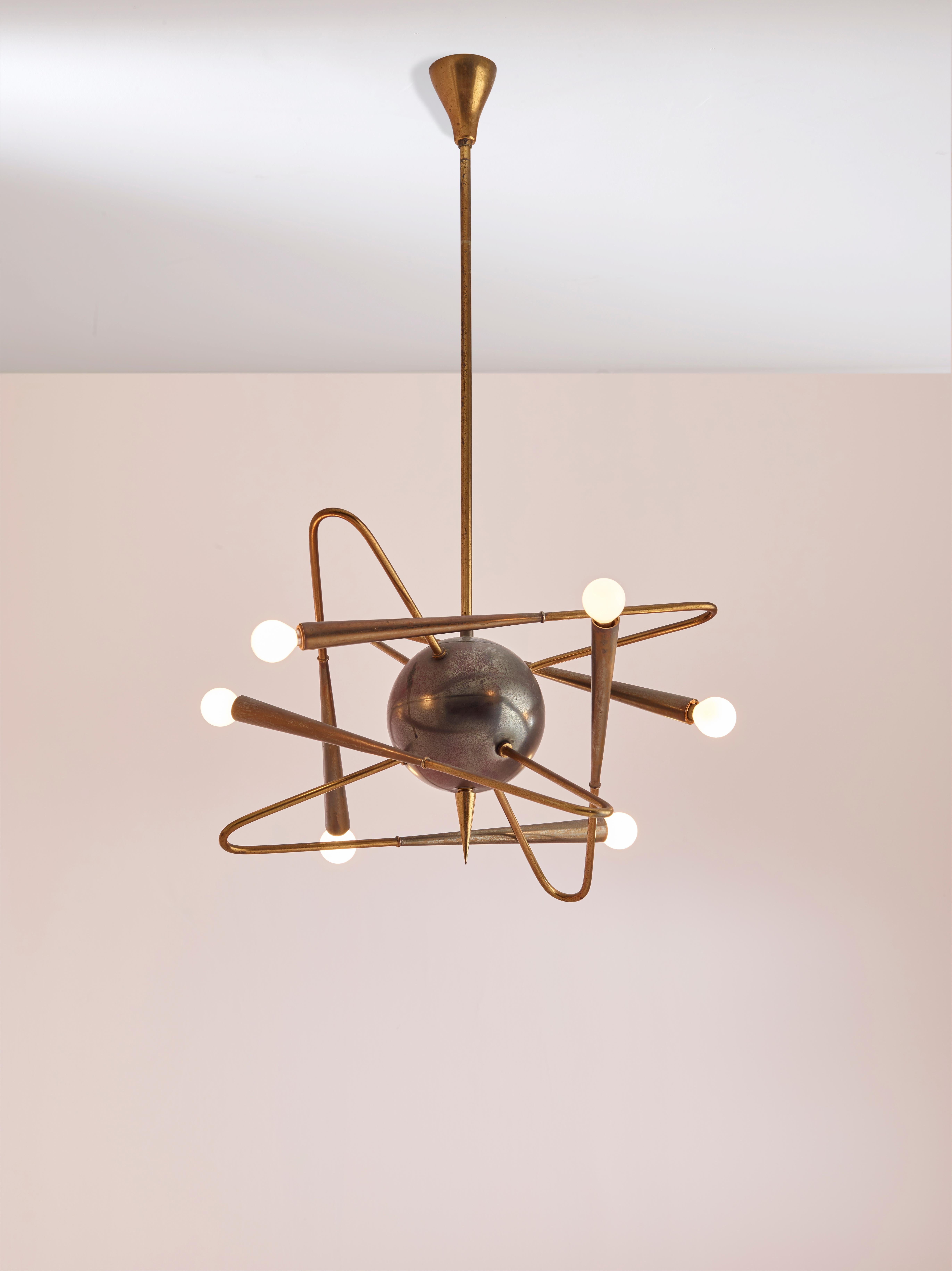A rare Stilnovo sputnik chandelier manufactured in Italy during the 1950s.

It features a central burnished brass sphere held by a rigid brass rod and six curved arms which recall to a satellite shape giv to the chandelier a beautiful and elegant