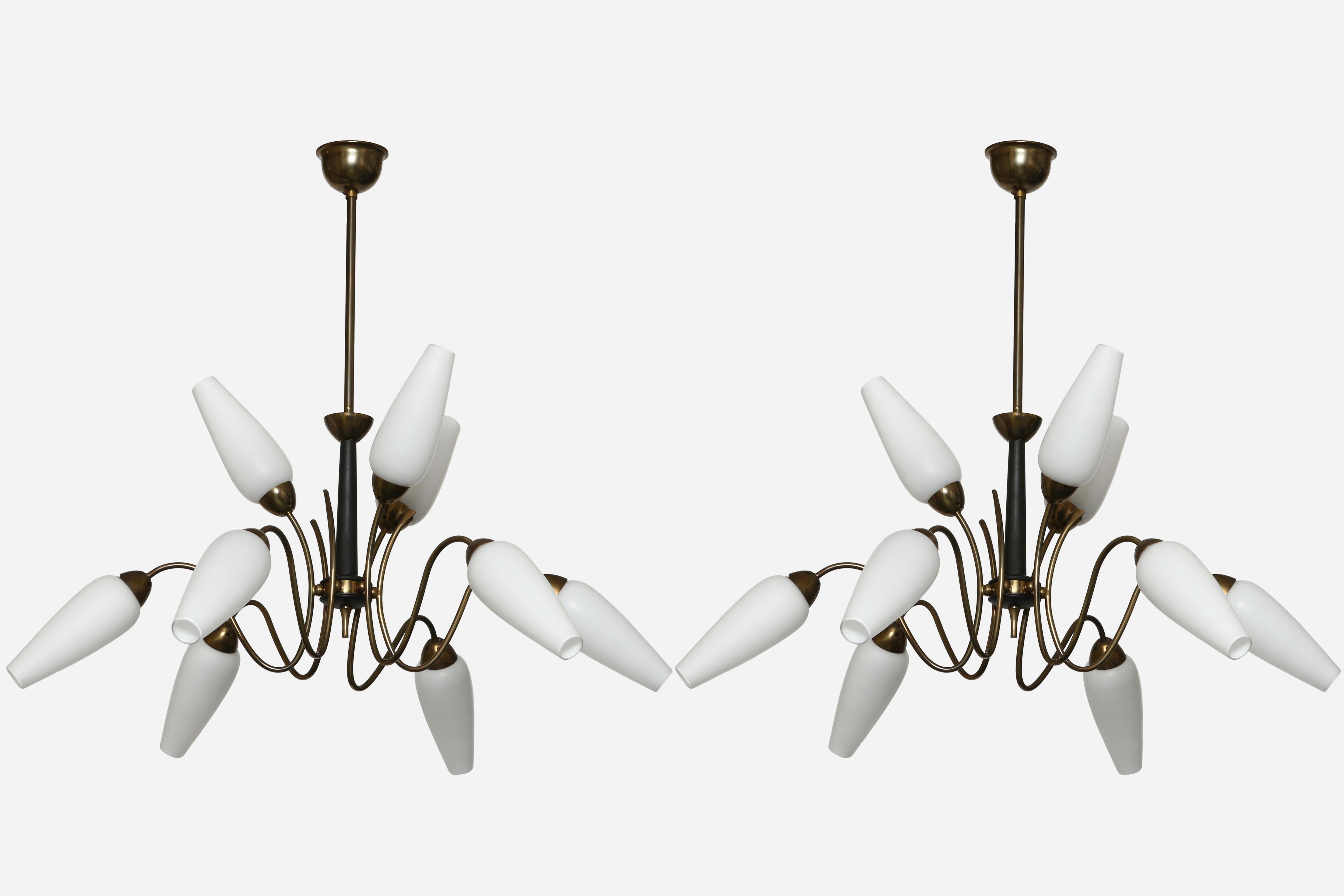 Stilnovo style chandeliers, a pair
Italy 1960s
Nine arms with tulip shaped glass.
Nine candelabra sockets.
Complimentary US rewiring upon request.
Overall drop is adjustable. Can be shorter.

We take pride in bringing vintage fixtures to their full