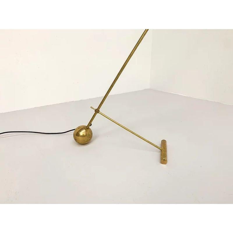 Stilnovo Style Diabolo Floor Lamp in Metal Shade with Brass Accents

Large Italian Diabolo floor lamp in the manner of Stilnovo. It features a red diabolo shaped metal shade with brass accents. Tha lamp has 2 bulbs, one pointing down and one