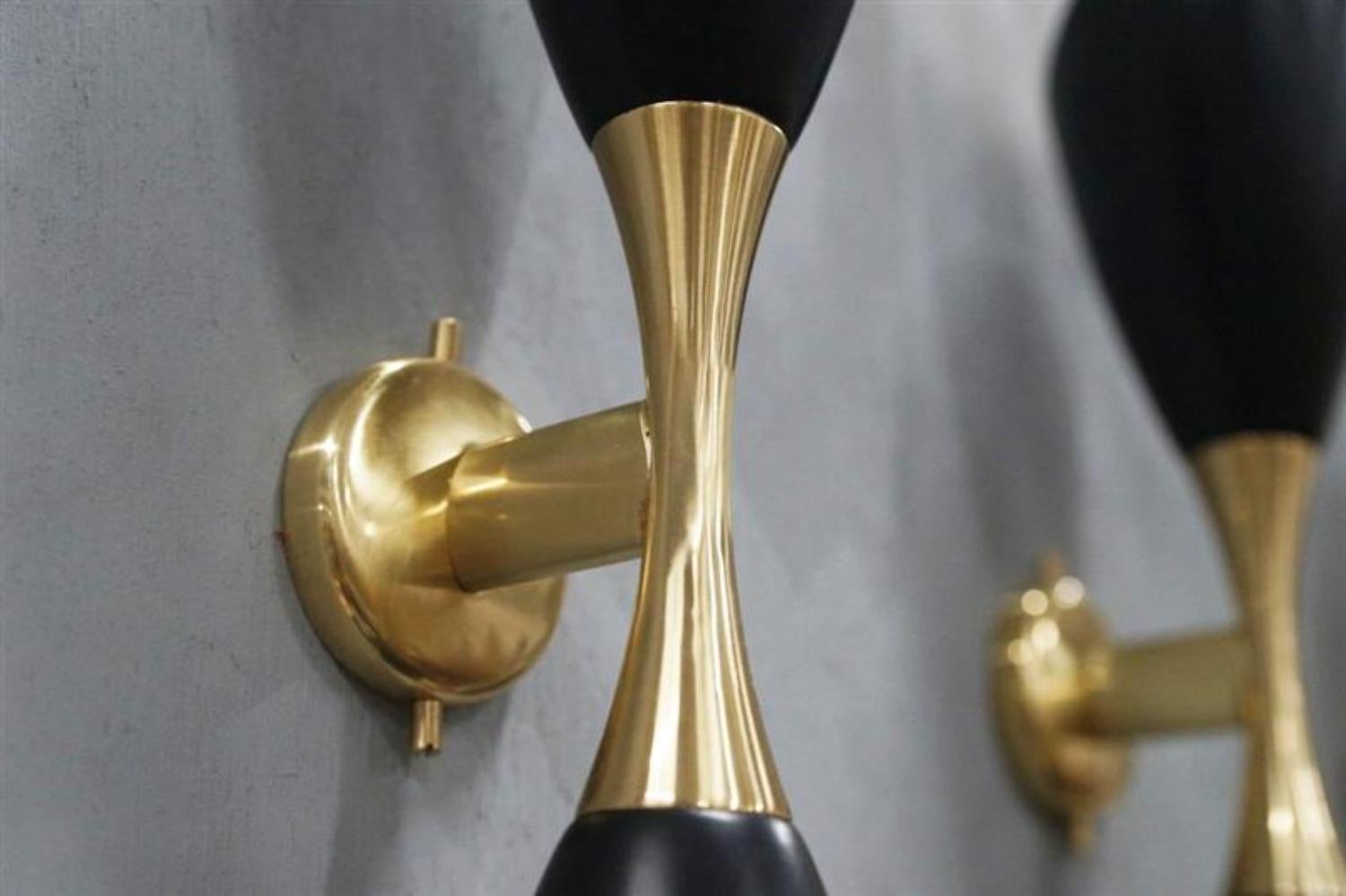 Pair of Very Elegant Italian Sconces
Solid Brass enameled black cones
In the style of Stilnovo 
Not UL certified 