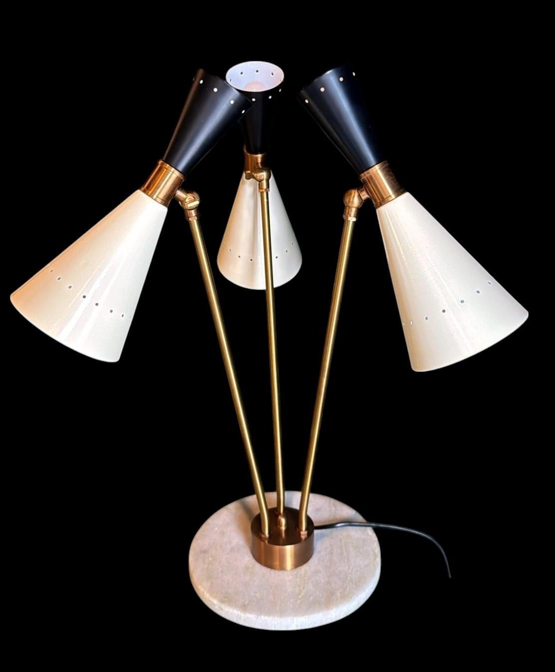 We kindly invite you to read the full description below, where you'll find detailed technical and historical information to guarantee the authenticity and quality of our items.
Iconic and refined Italian table lamp crafted in brass, featuring a