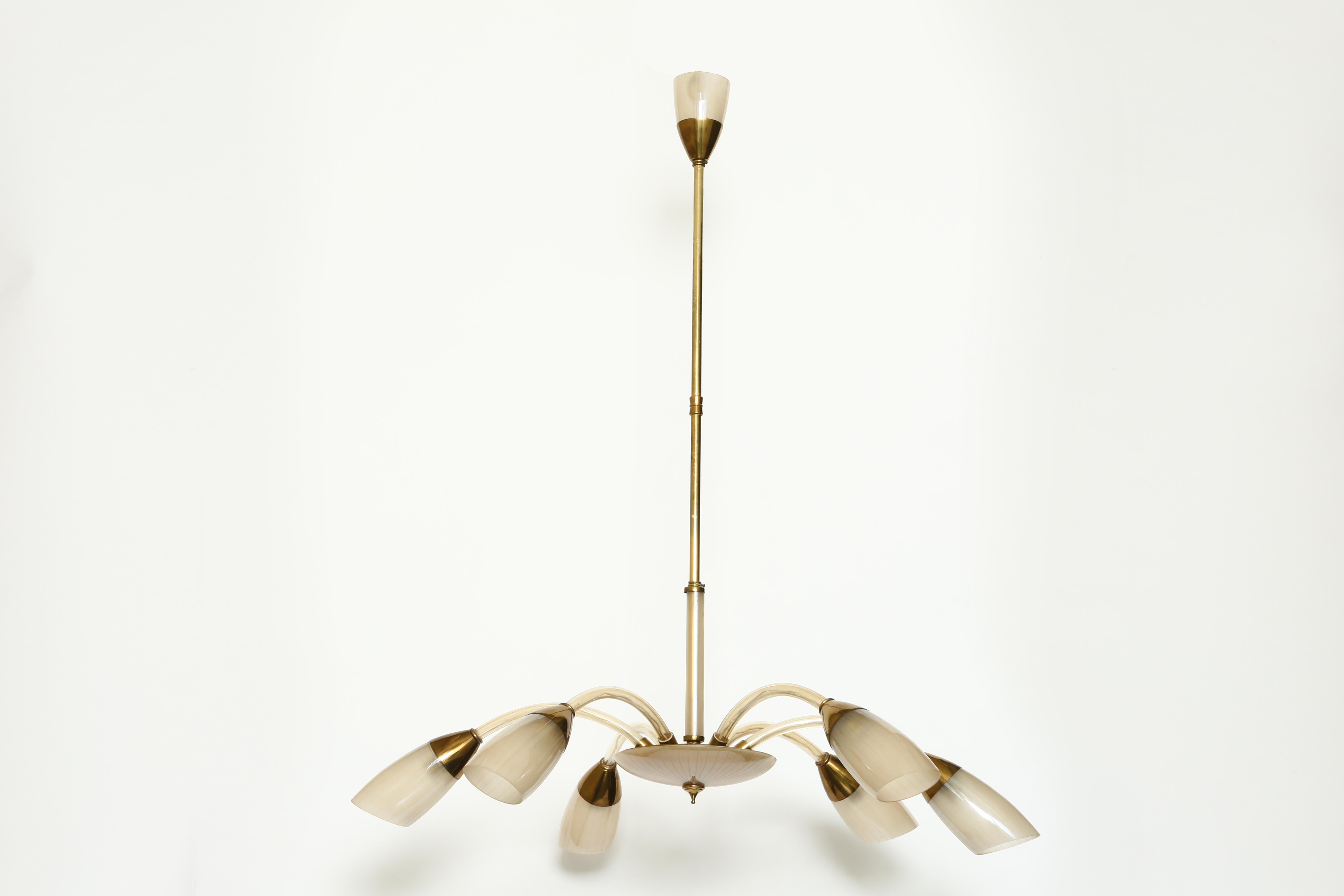 Stilnovo style Italian chandelier with six arms.
Made with brass and beautiful peach color glass.

   