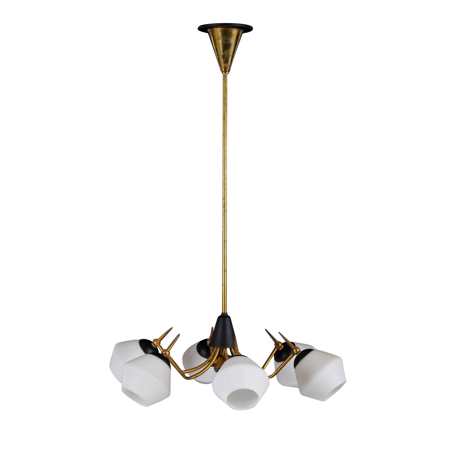 Stilnovo style mid-century chandelier from Italy. Gilt-brass and black painted metal frame six-arm chandelier with white glass shades. Newly wired, using all UL approved parts, for use within the USA accommodates candelabrum-size bulbs. New