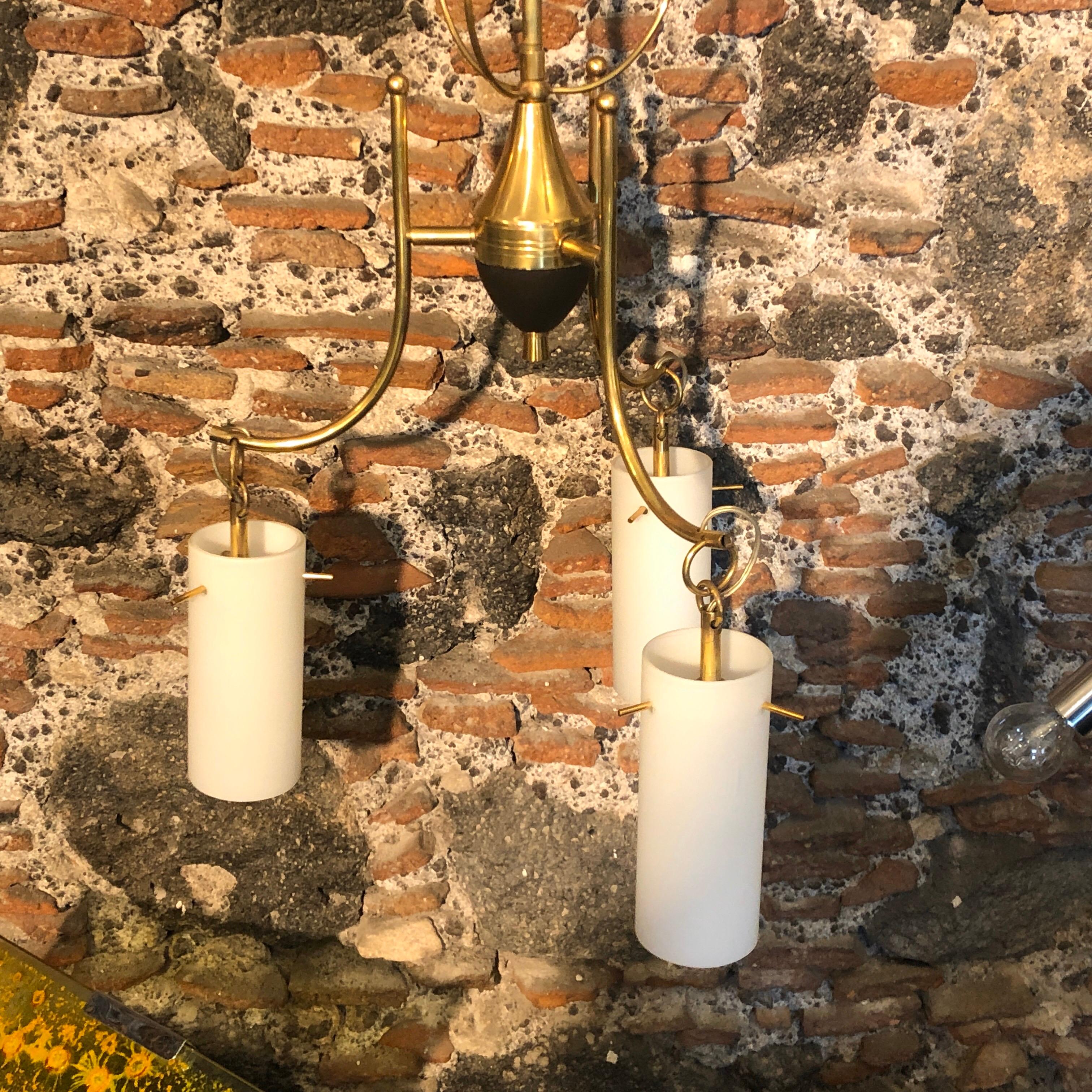 A Mid-Century Modern brass and white glass chandelier in perfect conditions, it works 110-240 volts and need regular e14 bulbs, fully restored electrical parts.