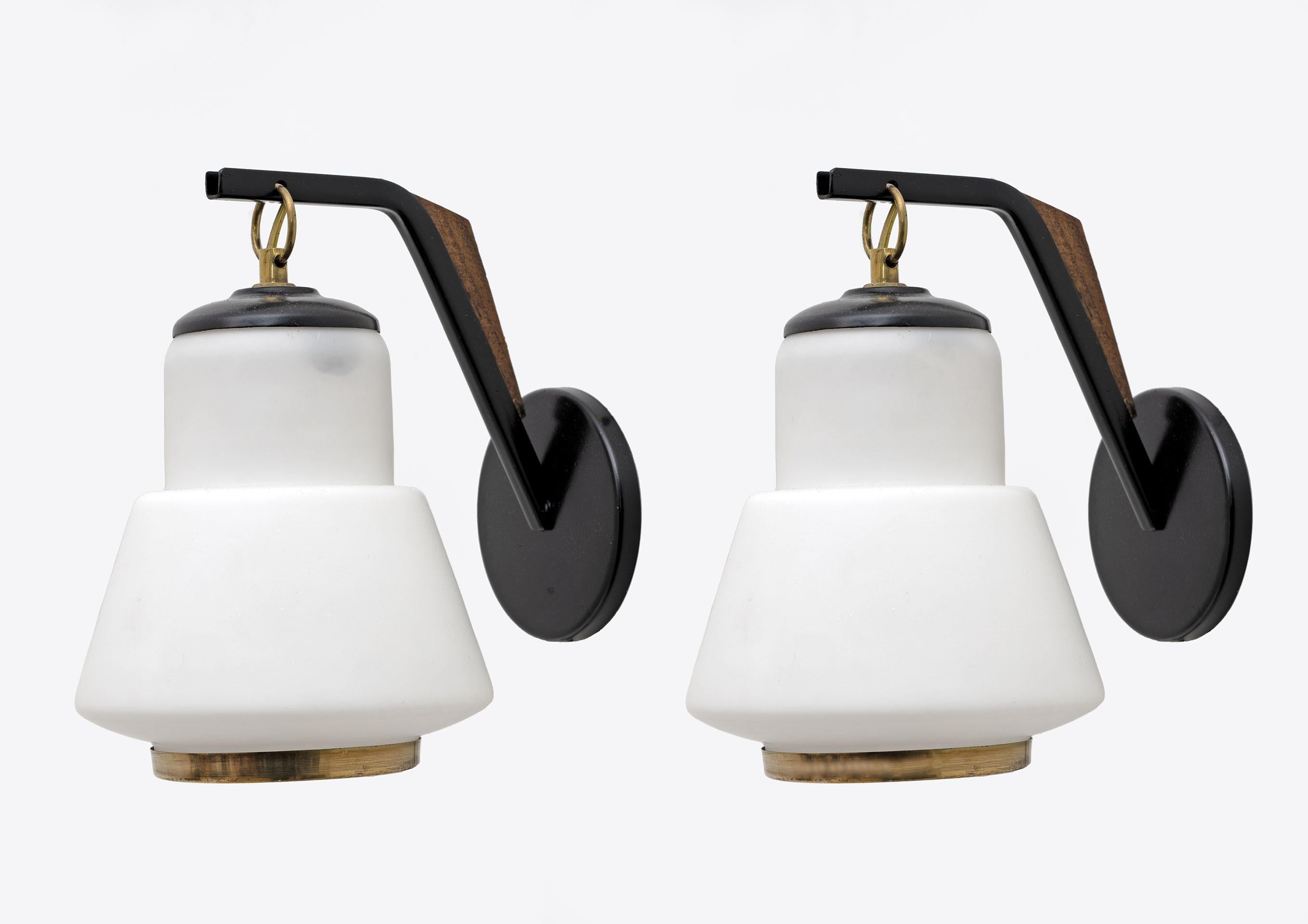 Pair of wall lights in black lacquered metal, wood, brass and opaline glass. In the style of Stilnovo in Italy in the 1950s.