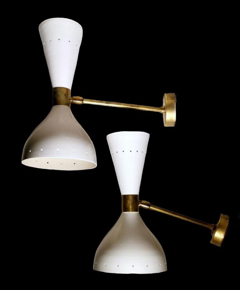 We kindly suggest you read the whole description, because with it we try to give you detailed technical and historical information to guarantee the authenticity of our objects.
Iconic and distinctive pair of wall sconces; they are made of brass