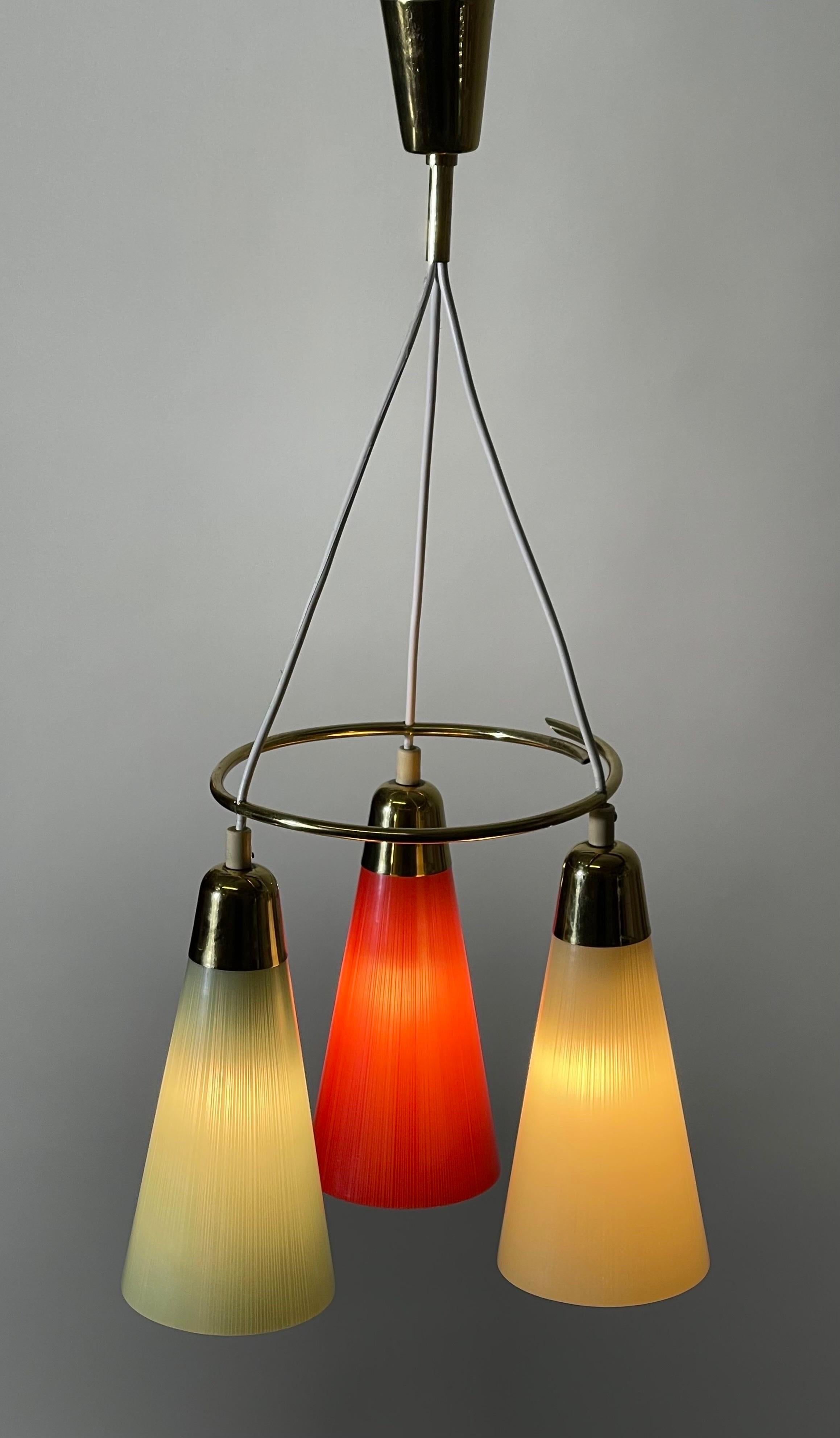 Mid - Century polished brass and multicolor pendant in the style of Stilnovo.
Socket: 3 x e14 for standard screw bulbs.