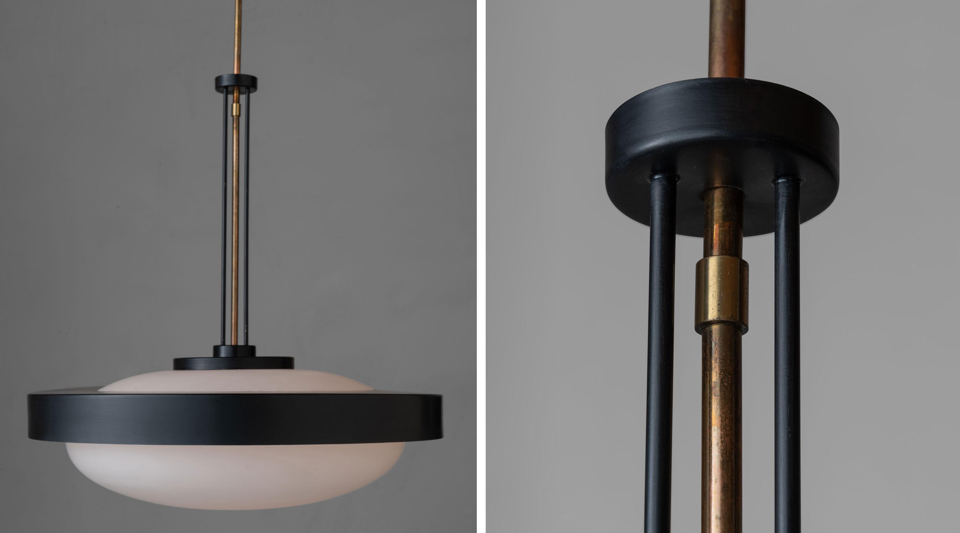 Stilnovo suspension lamp, Italy, 1950.

Brass, painted metal and opaline glass lamp attributed to Bruno Gatta for Stilnovo.