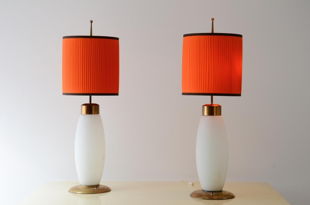 cod-2370
Stilnovo

Unique pair of large table lamps in opaline lighted glass, brass details and silk shads.

Manufacture label, 1960's.
