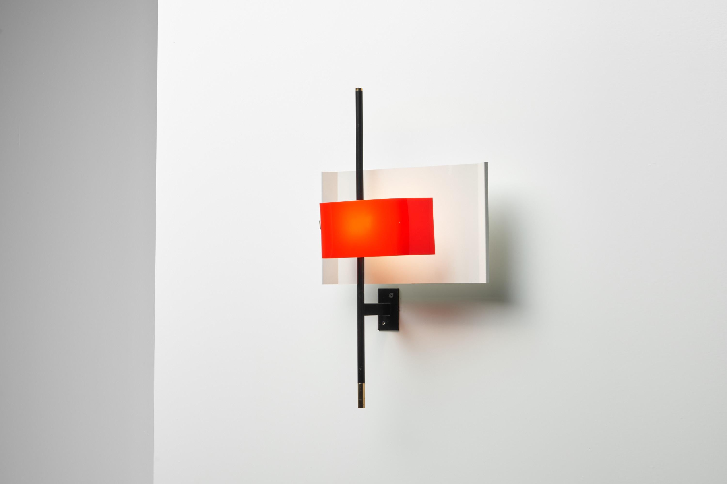 Spectacular large sized sculptural wall lamp model 2020 designed by Bruno Gatta and manufactured by Stilnovo, Italy 1955. This is for a very nice minimalist wall lamp with black lacquered arm, a white lacquered shade, a red plexiglass diffuser and