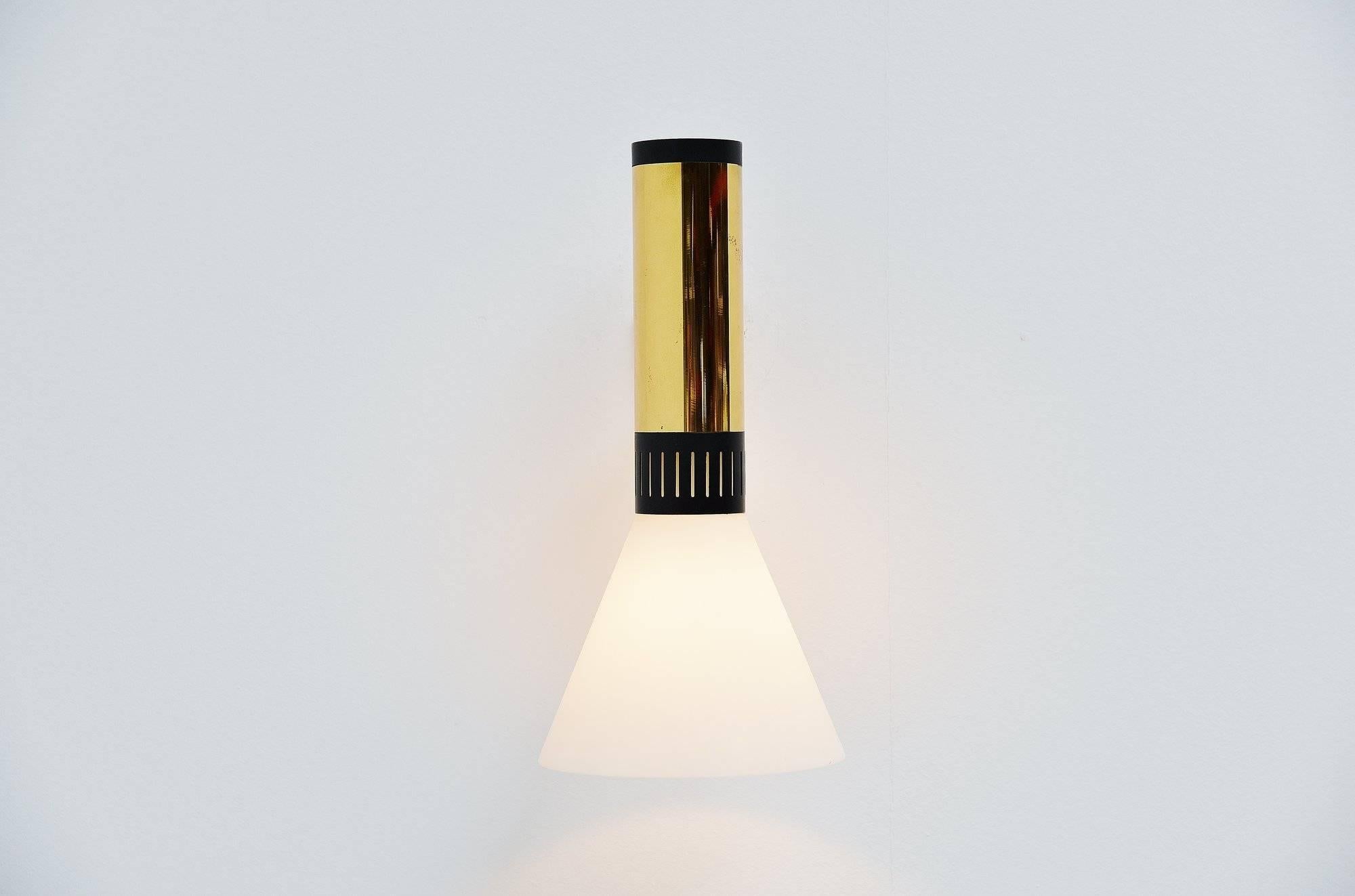 Very nice and large wall lamp model 2109 designed and manufactured by Stilnovo, Italy, 1950. This is for a very nice modernist shaped wall lamp conical shaped shade with brass, painted metal and glass diffuser shade. A brass arm hold the shade and