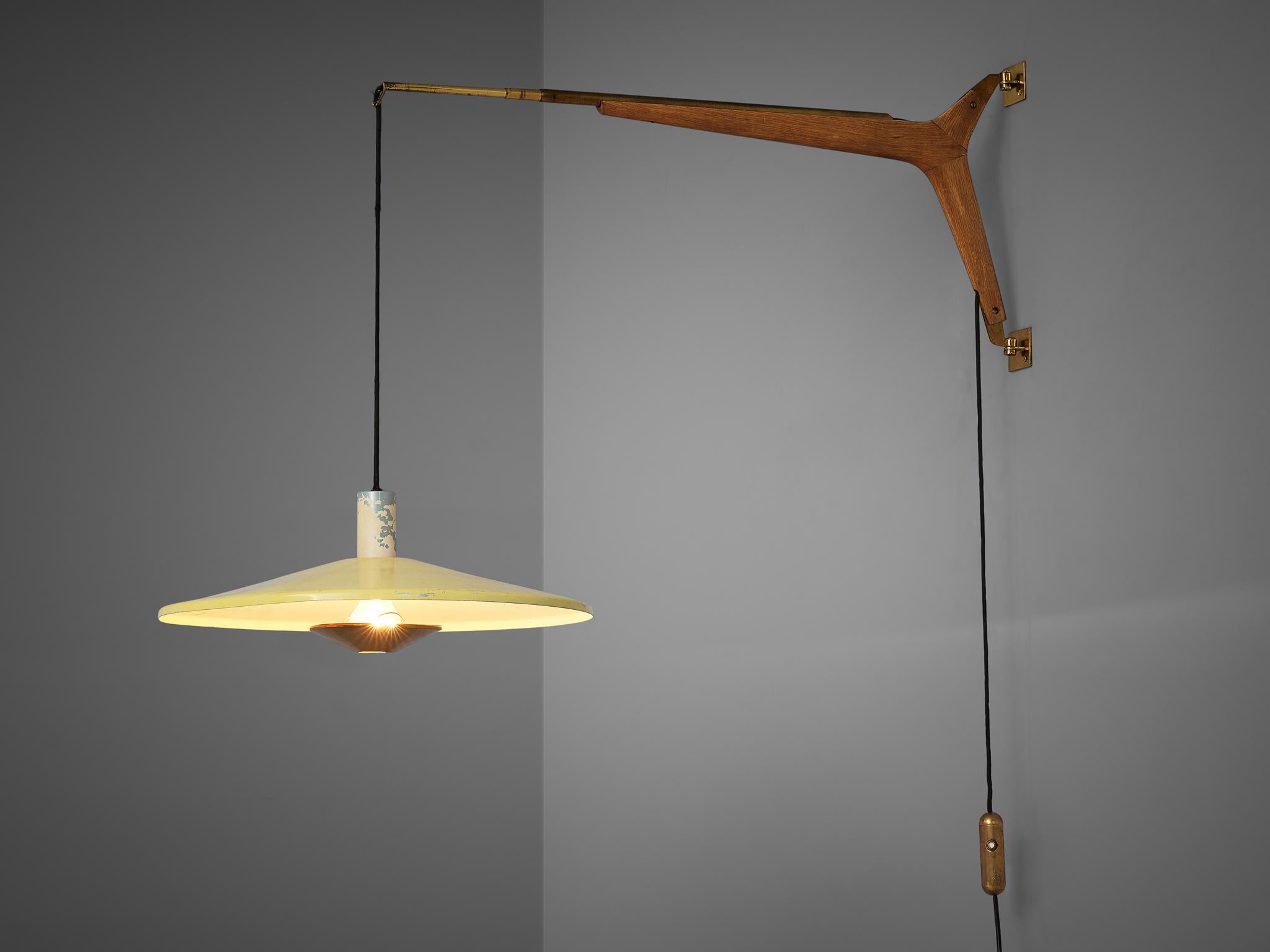 Wall light, cream and yellow lacquered metal, brass, oak, cloth covered wiring, Italy, 1960s

This ceiling lamp is an excellent example of the 'new style' Italian lighting designs of the 1950s and 1960s. Its soft yellow shade contrast with the
