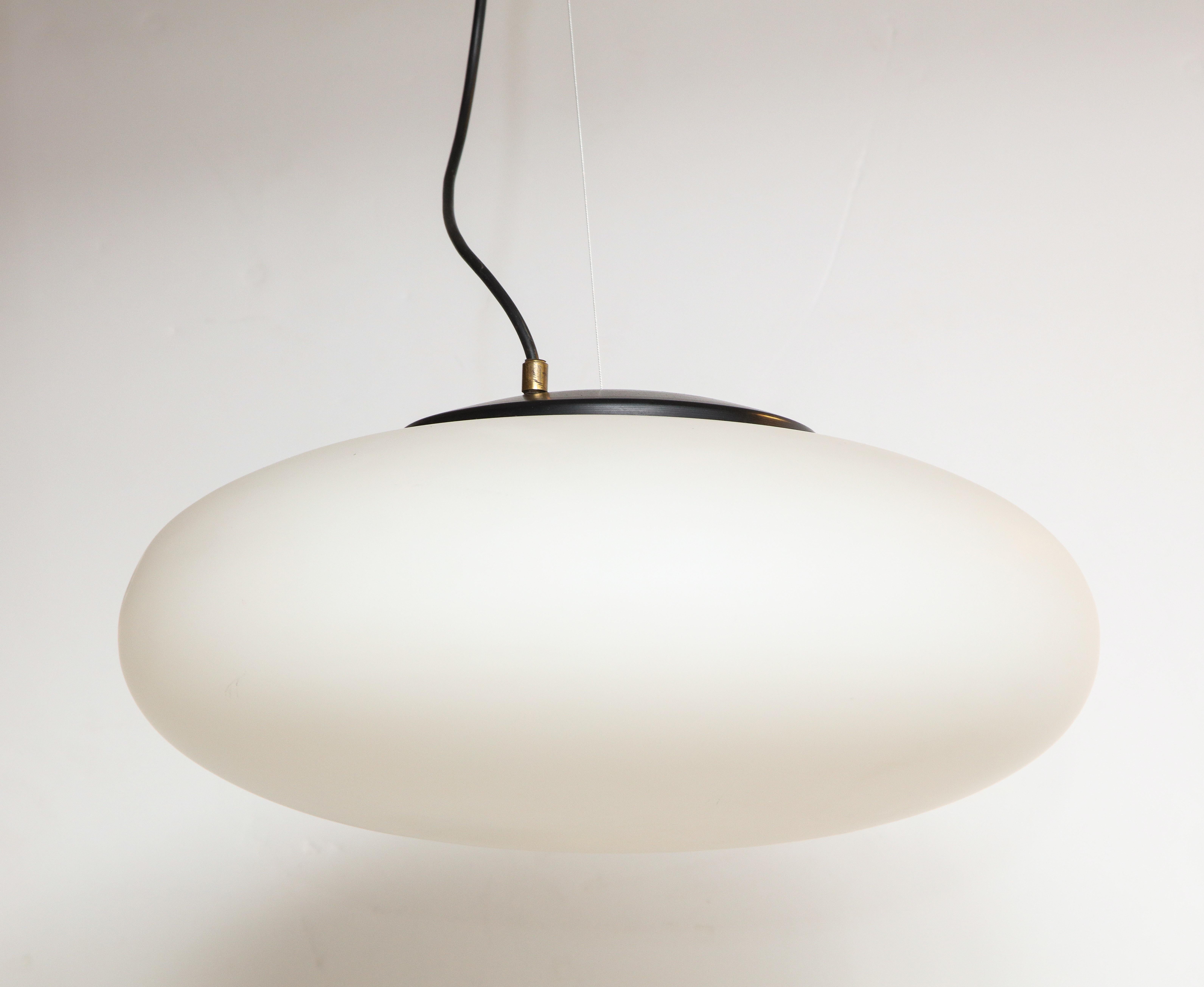 Stilnovo suspension light/chandelier, Italy, circa 1950s-1960s
Metal, brass, white opaque milk glass

Measures: H 31 (Drop adjustable), diameter 18 in. (H of globe: 5-6”).