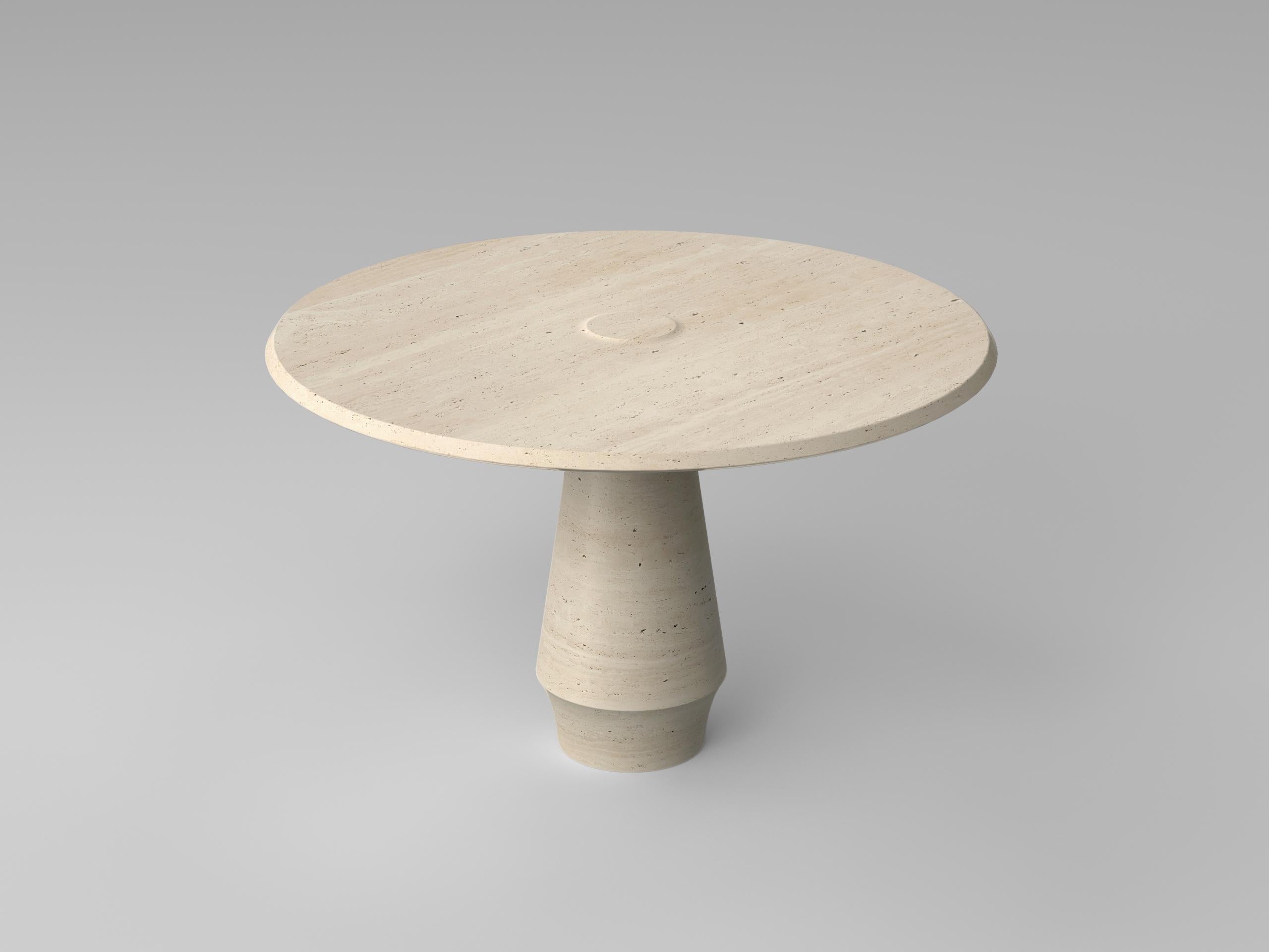 Stilo is crafted in Roman Travertine, celebrating the stone’s natural warmth and subtle tonal movement.

The sculptural base is carved from a single monolithic block, emphasizing continuity, strength, and purity of form. The soft taper of the