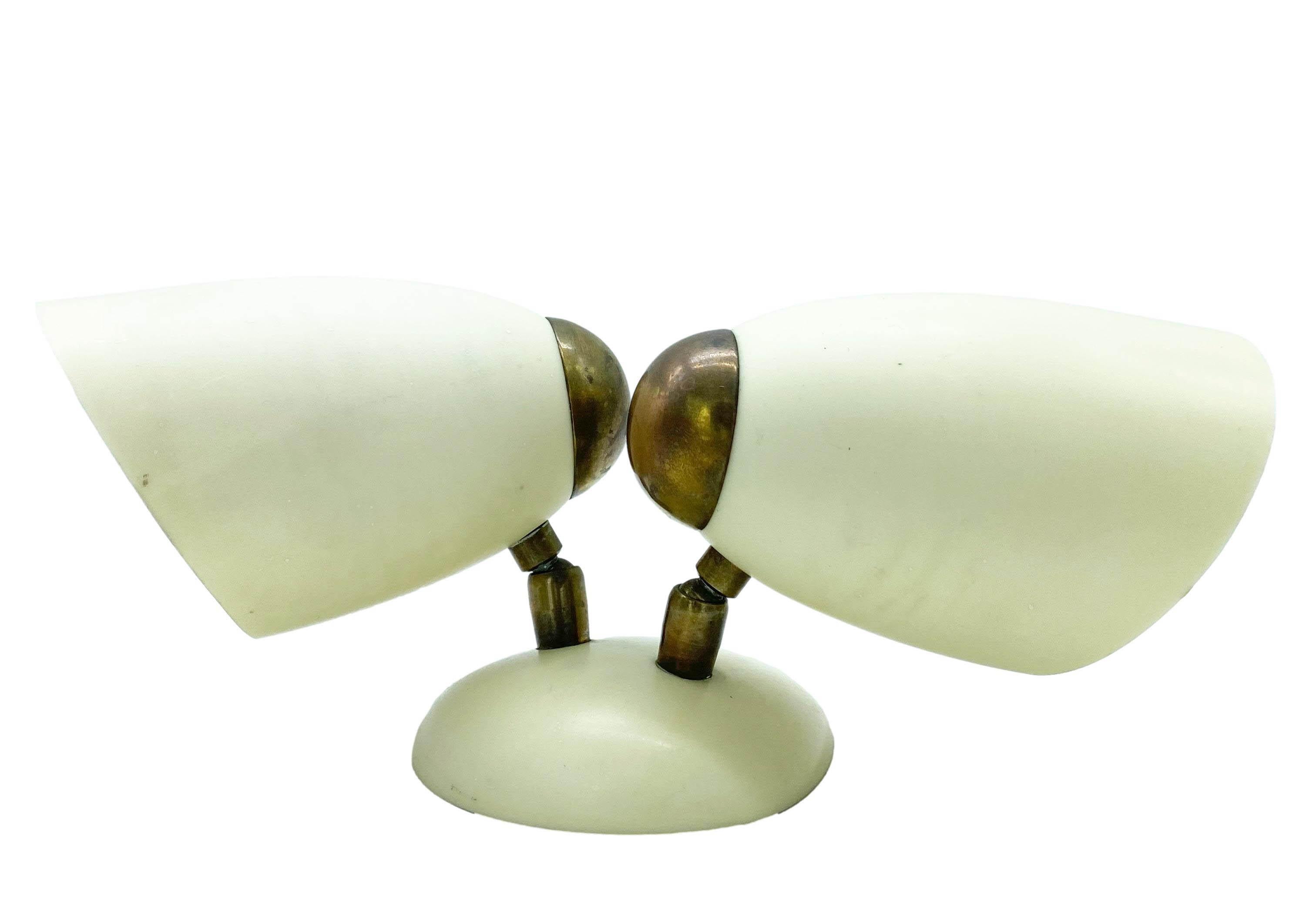 Ivory acrylic and brass wall lamp with two adjustable lights, Stilux 1960s. 