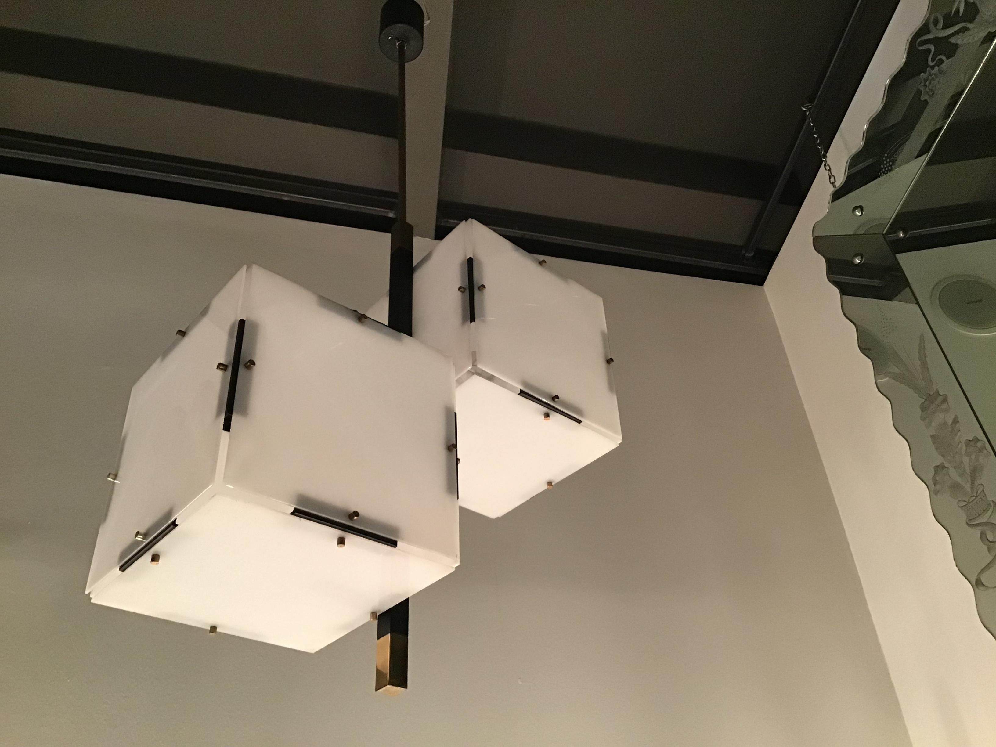 Stilux chandelier Brass, metal and  white plexiglass, 1960, Italy.