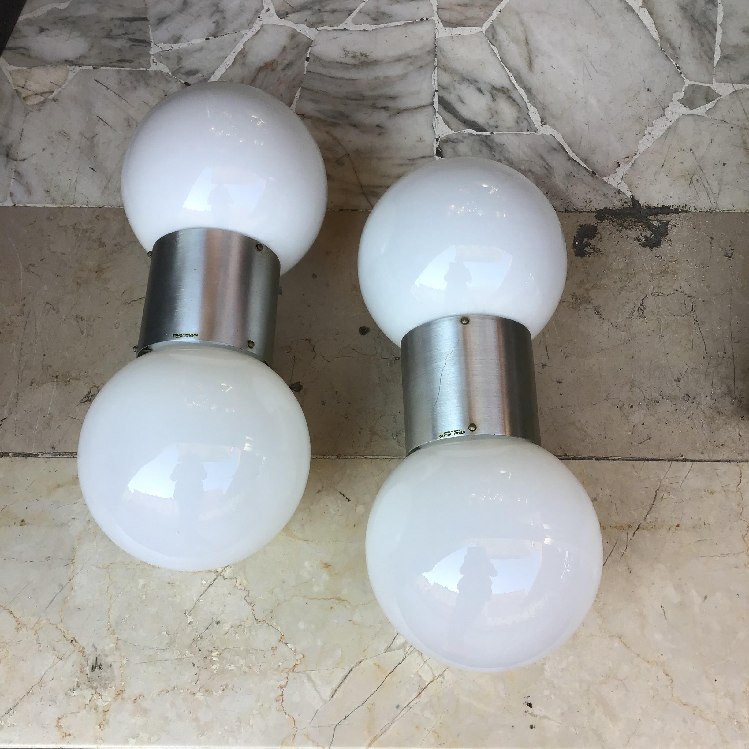 Stilux wall sconce pair with double light.