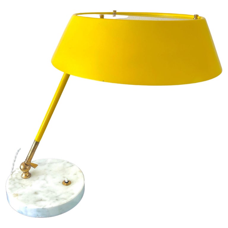 Handsome table lamp by Stilux Italia - circa 1950
Carrera marble base with brass adjustable arm and mustard yellow shade. 
newly rewired. 
 