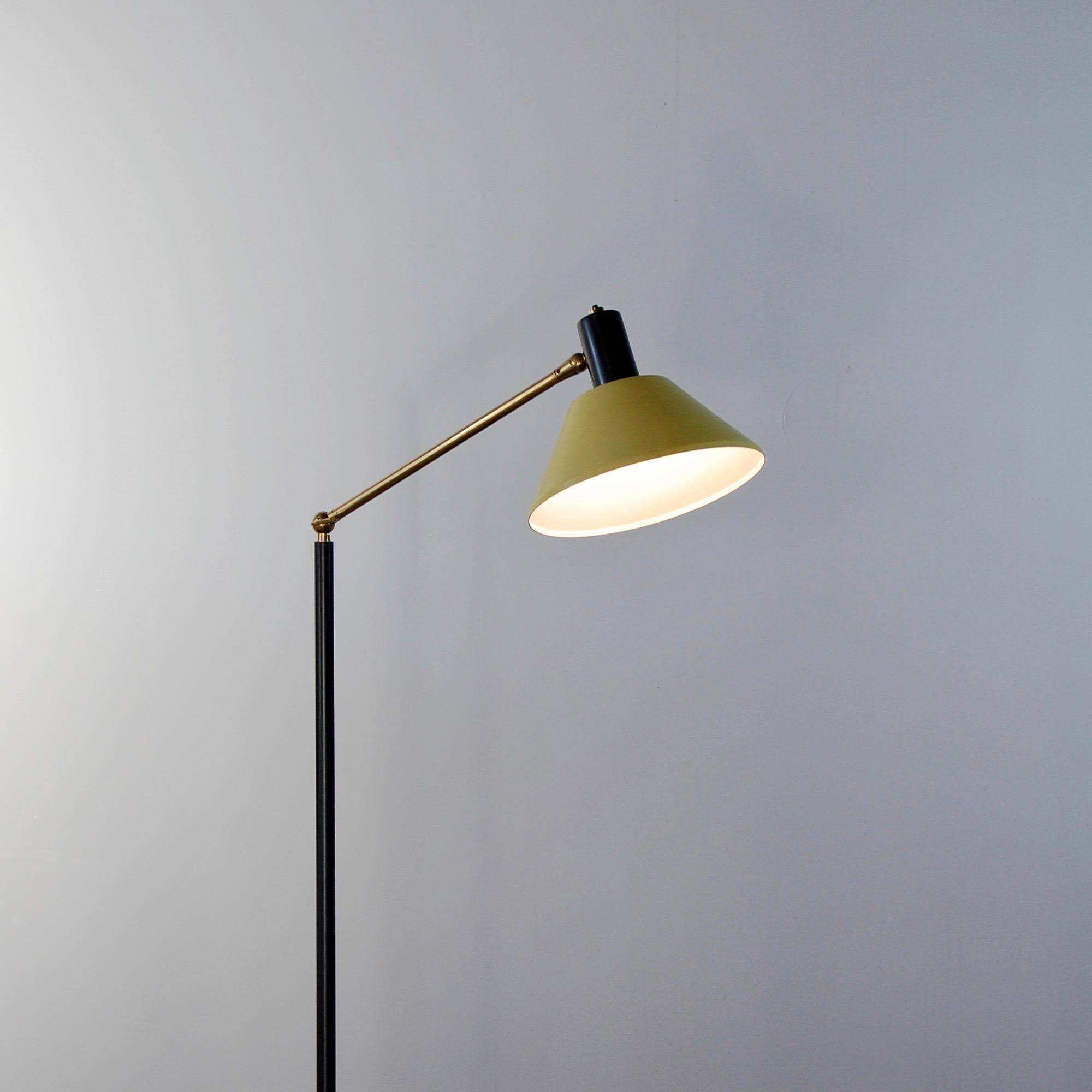 1950s Italian floor lamp by Stilux. Yellow painted aluminum shade and black painted steel. Brass elbow and marble base. Rewired with single E26 medium based socket. Currently wired for use in the US. Light bulb included in order.