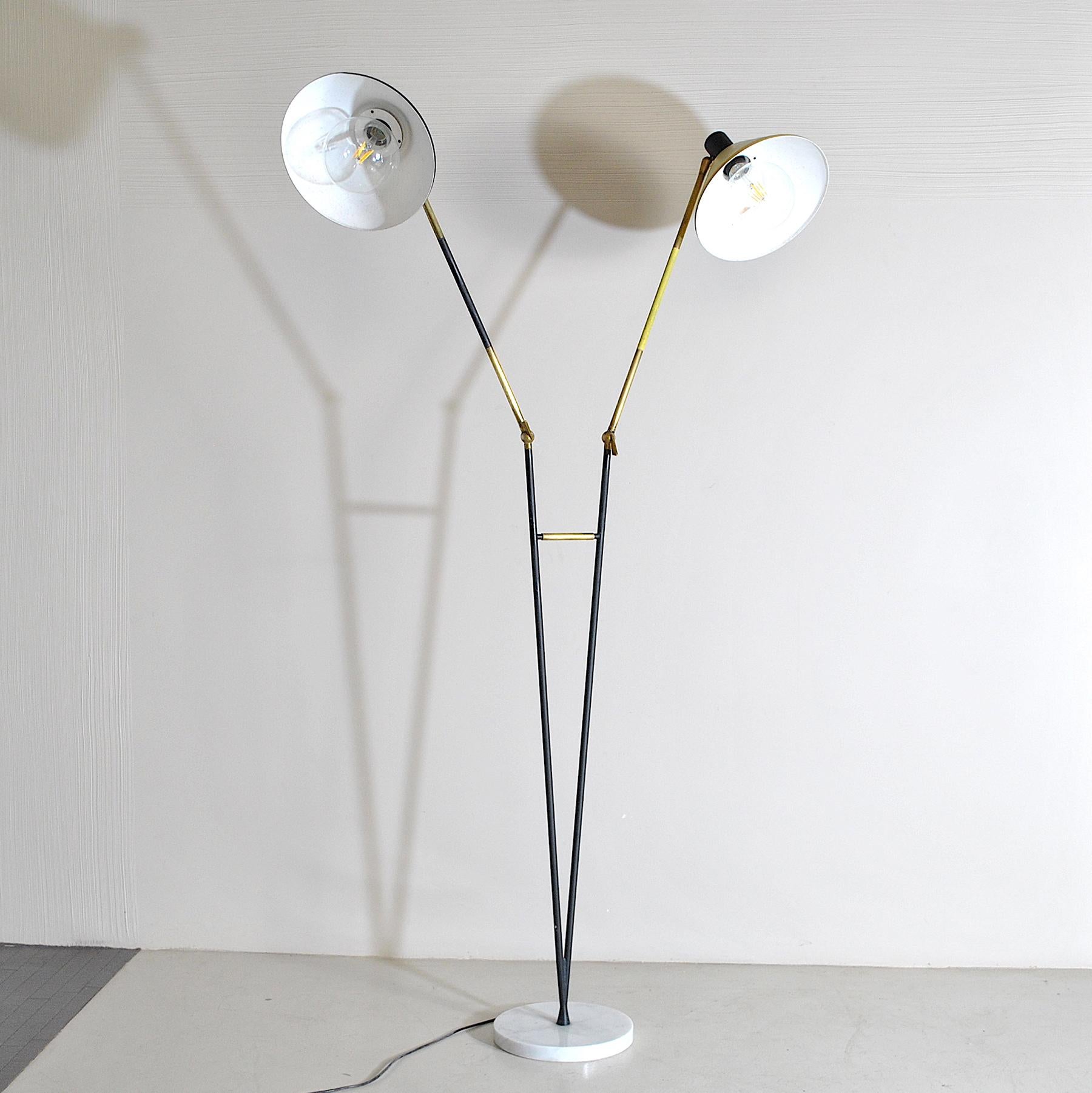 Superb double cone floor lamp with marble base produced by Stilux from the 1950s, a must for period lighting and vintage lighting now.

Stilux was one of the most innovative lighting design companies in Italy during the mid-century. Their projects