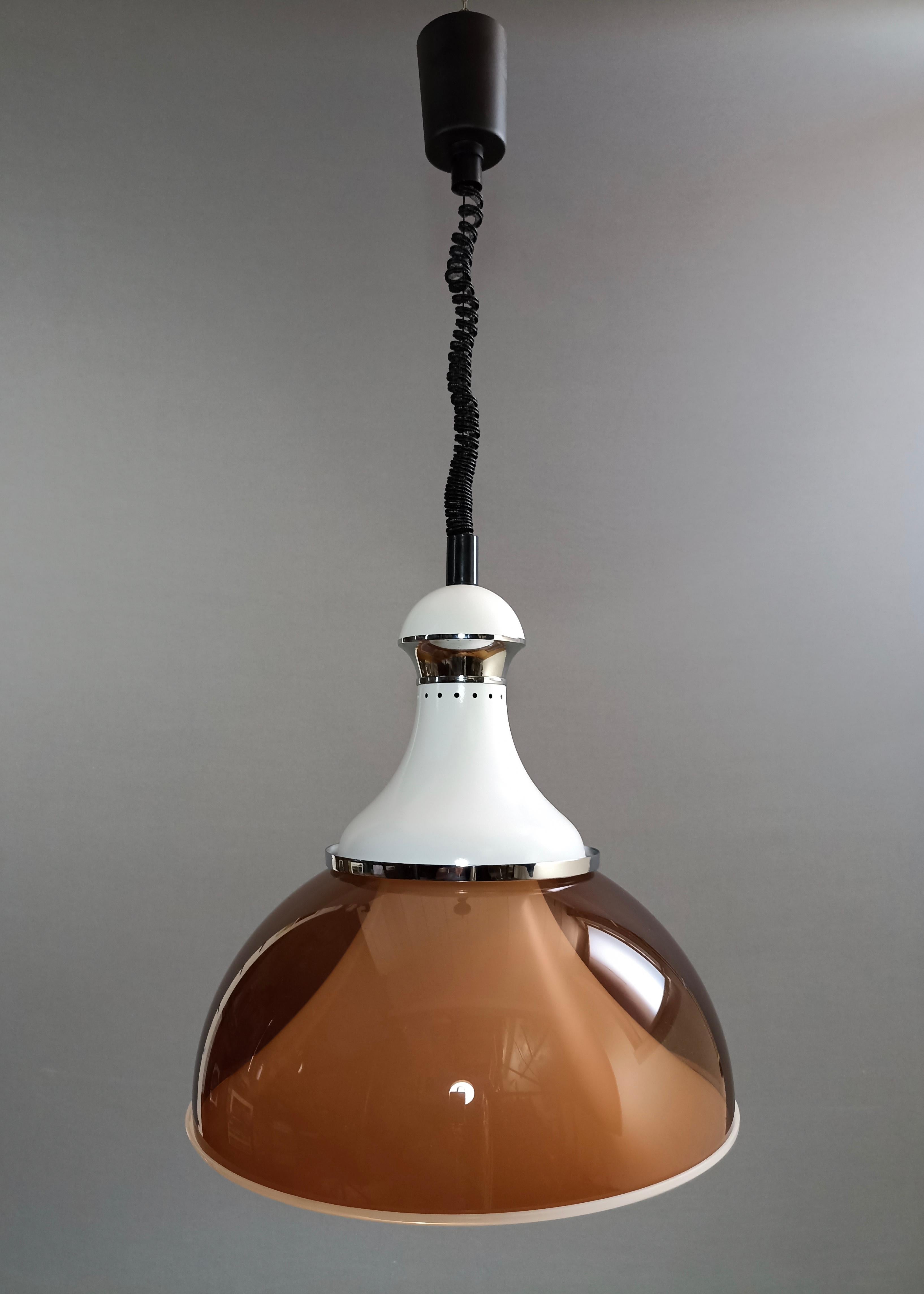 Beautiful and rare large Space Age pendant lamp adjustable in height, in Perspex, white lacquered aluminum and chrome accents. Italy, 1960s-1970s. 
This is a model with a well-known design and, although lacking a trademark, it is referable to the