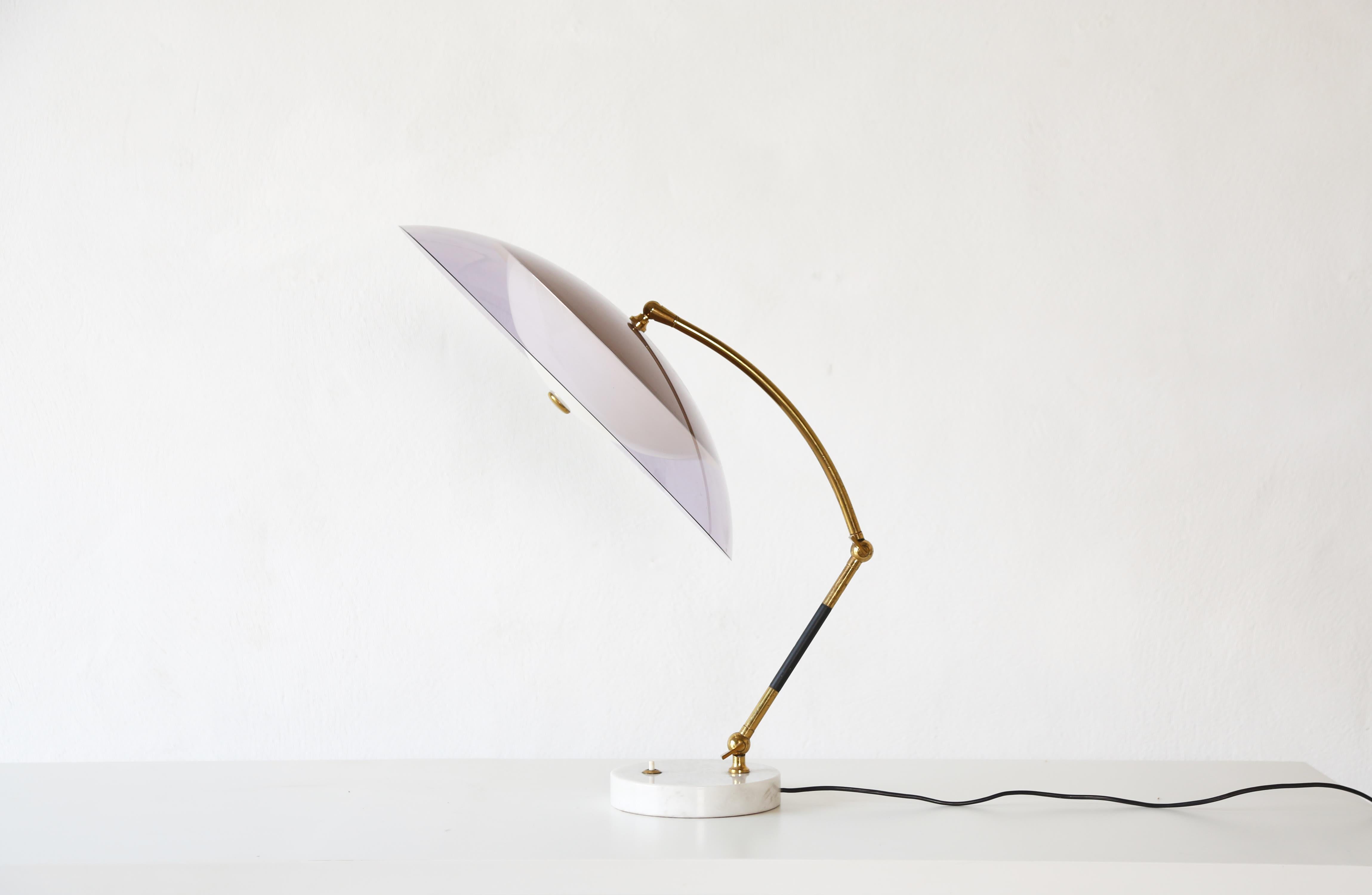 An elegant adjustable desk lamp, made by Stilux Milano, Italy in the 1960s. With a marble base, brass arm and perspex pink shade. In good original vintage condition with minor signs of use and age. Requires local rewiring prior to use. Fast shipping
