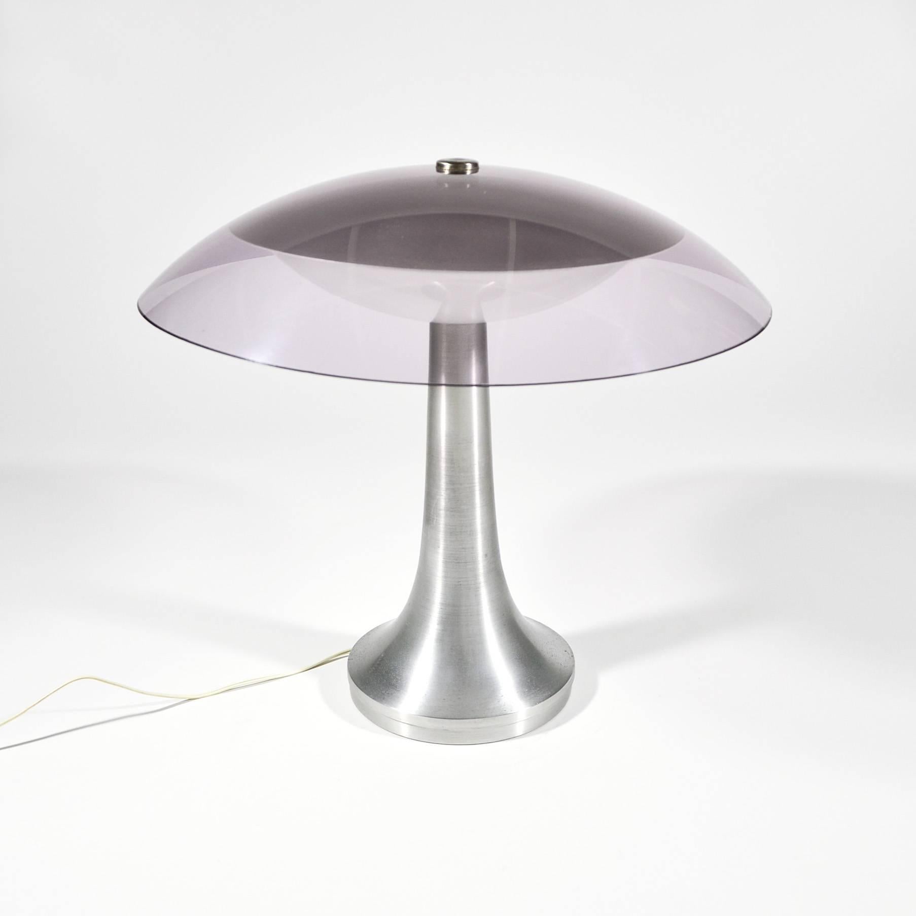 This Italian table or desk lamp was manufactured by Stilux Milano during the 1960s. It features a brushed aluminium base and Plexiglass diffusers, white and transparent mauve, and is in good original condition.