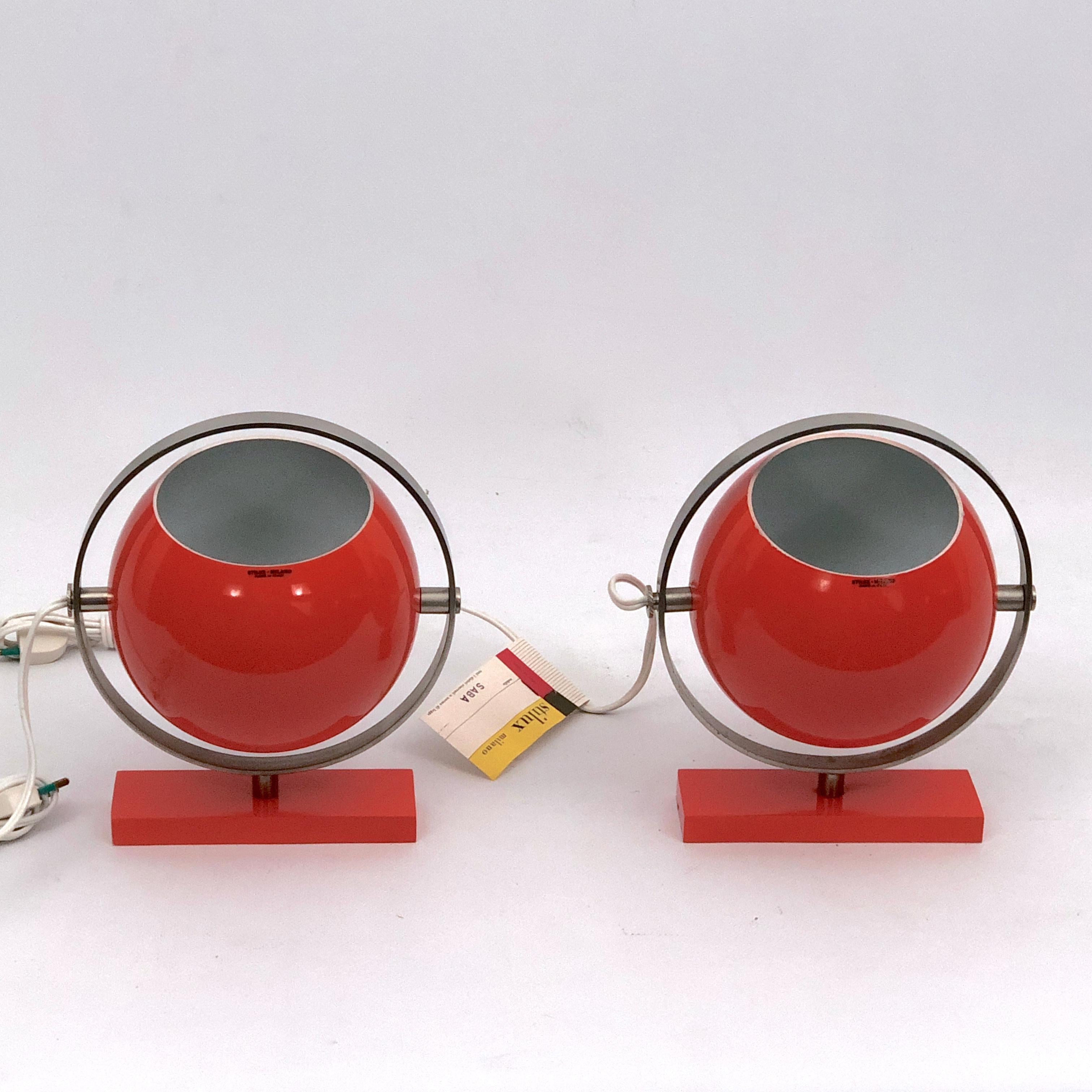 Extremely rare as a pair, orange globe table lamps produced by Stilux Milano during the 60s. Vintage never used with label and original tag. Small loss of lacquer on one lamp as shown in the pictures. Full working with EU standard, adaptable on
