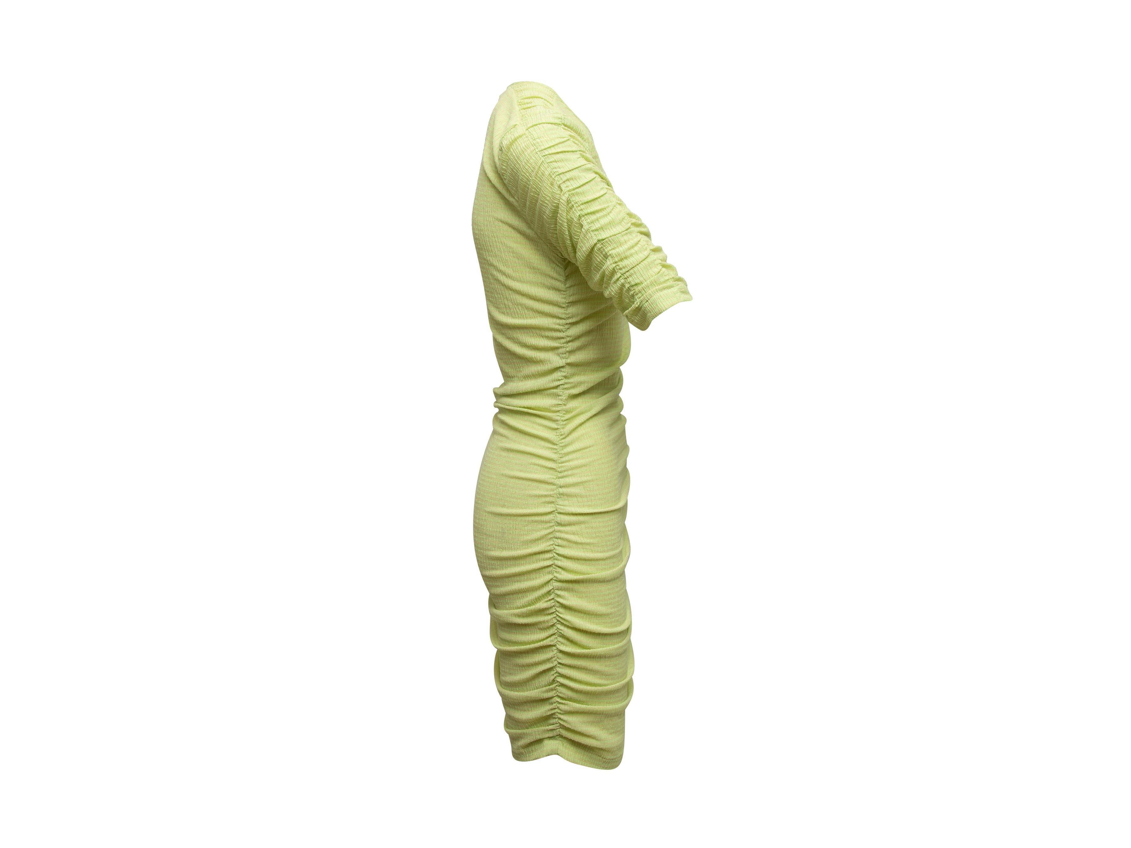 Product details: Light green ruched bodycon mini dress by Stine Goya. Asymmetrical V-neck. Short sleeves. 30
