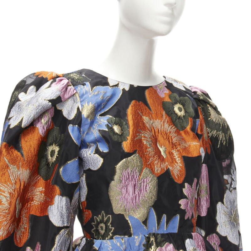STINE GOYA orange blue floral jacquard peplum balloon sleeves top XS
Reference: AAWC/A00278
Brand: Stine Goya
Material: Polyester, Blend
Pattern: Floral
Closure: Zip
Lining:  Fabric
Made in: China

CONDITION:
Condition: Excellent, this item was