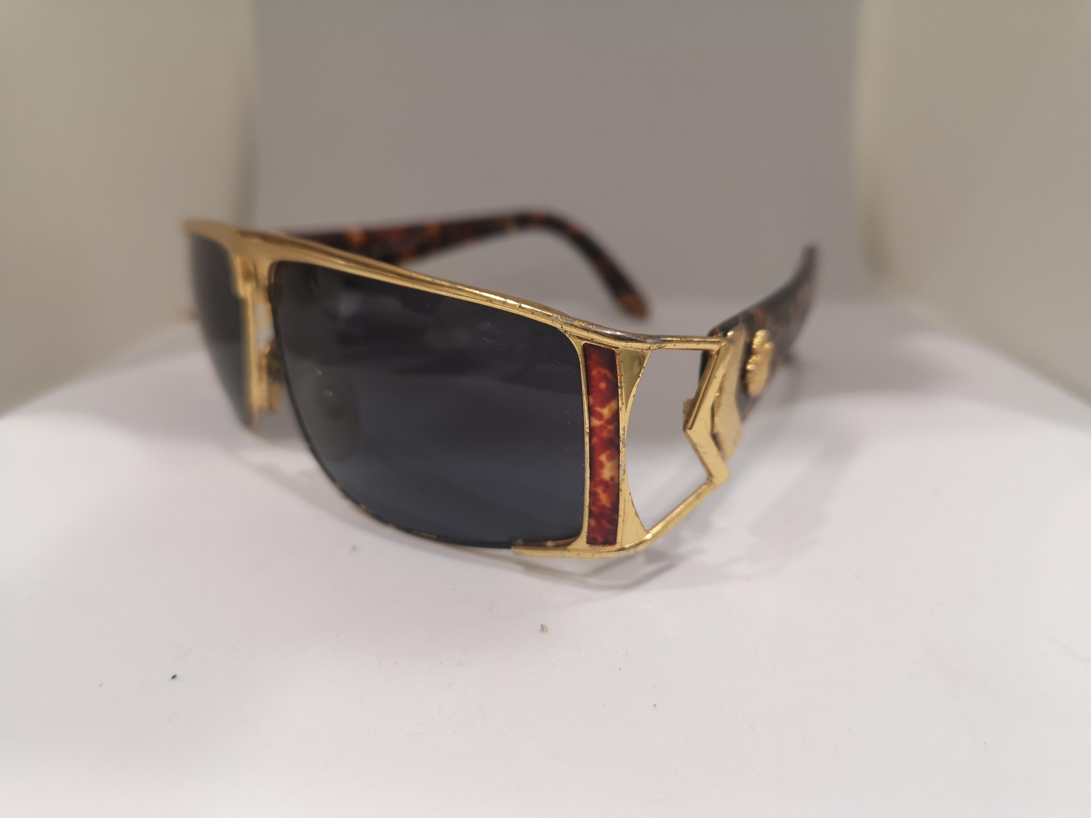 Men's Sting black lens gold tortoise sunglasses