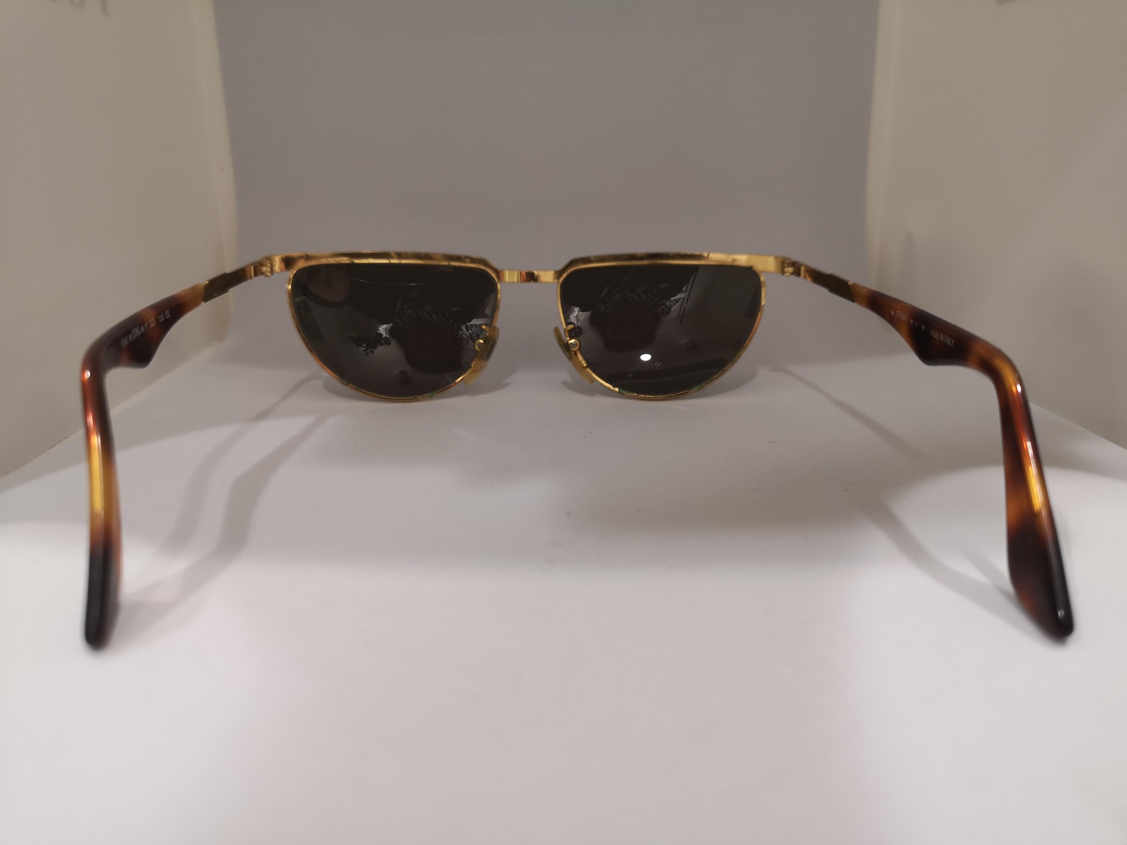 Women's or Men's Sting black lens tortoise gold sunglasses