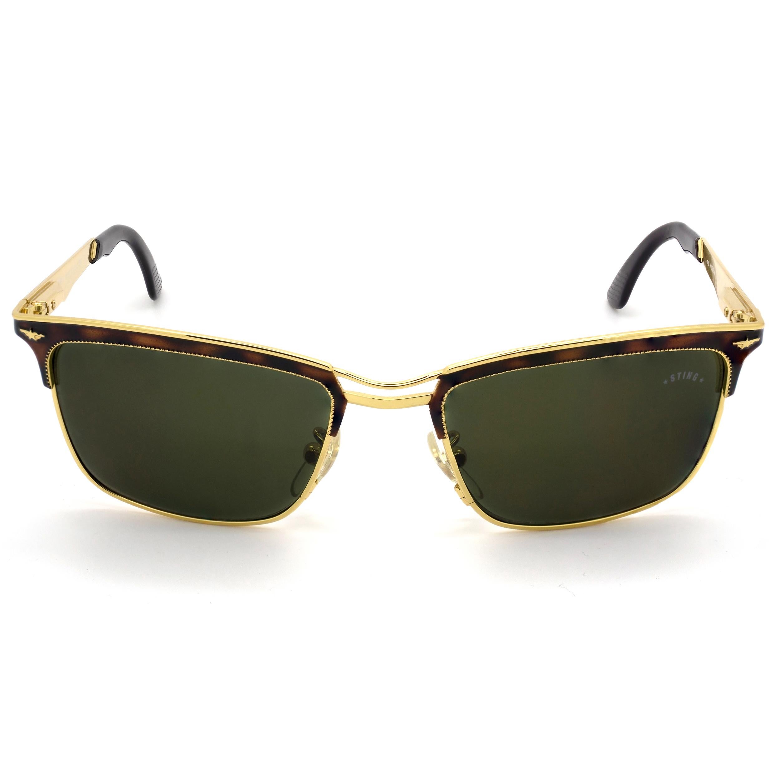 MAKE: Sting
MODEL: 4048 - 120
MADE IN: Italy
ERA: 1980s
CONDITION: New Old Stock [never worn]

DIMENSIONS:
Lens width: 50 mm  /  1 15/16 in
Lens height: 36 mm  /  1 7/16 in
Bridge: 19 mm  /  3/4 in
Temple-to-temple width: 130 mm  /  5 1/8 in
Temple